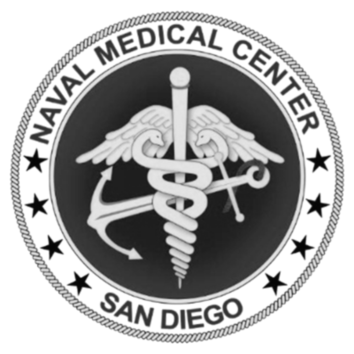Black and white medical emblem with caduceus and the words 'American Medical Center San Diego' around the edge.