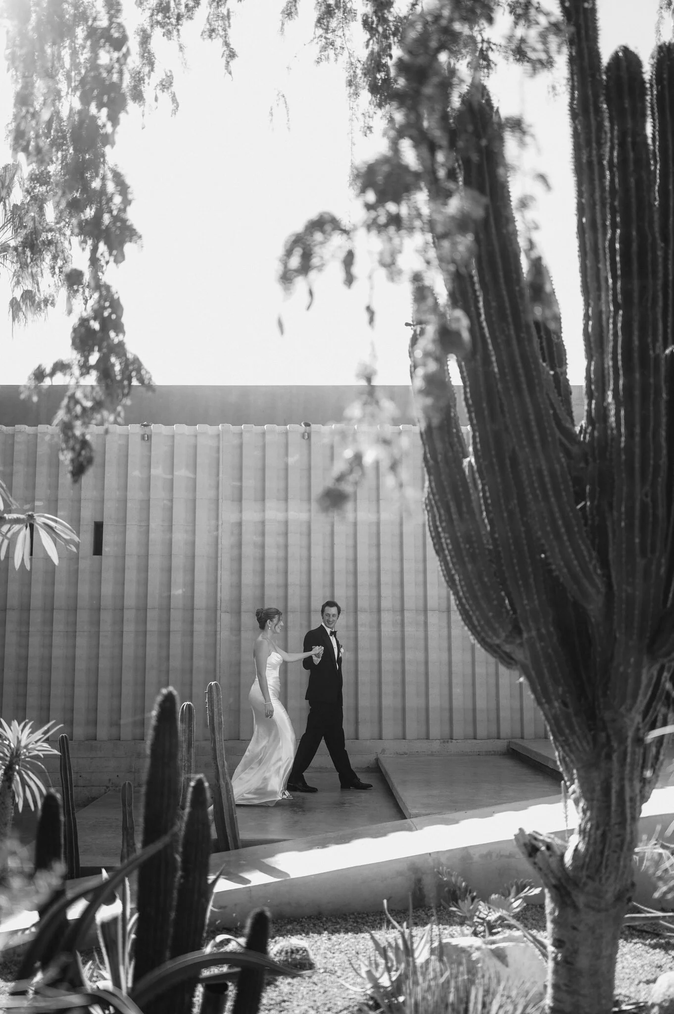Groom walk giving a guiding hand to his bride