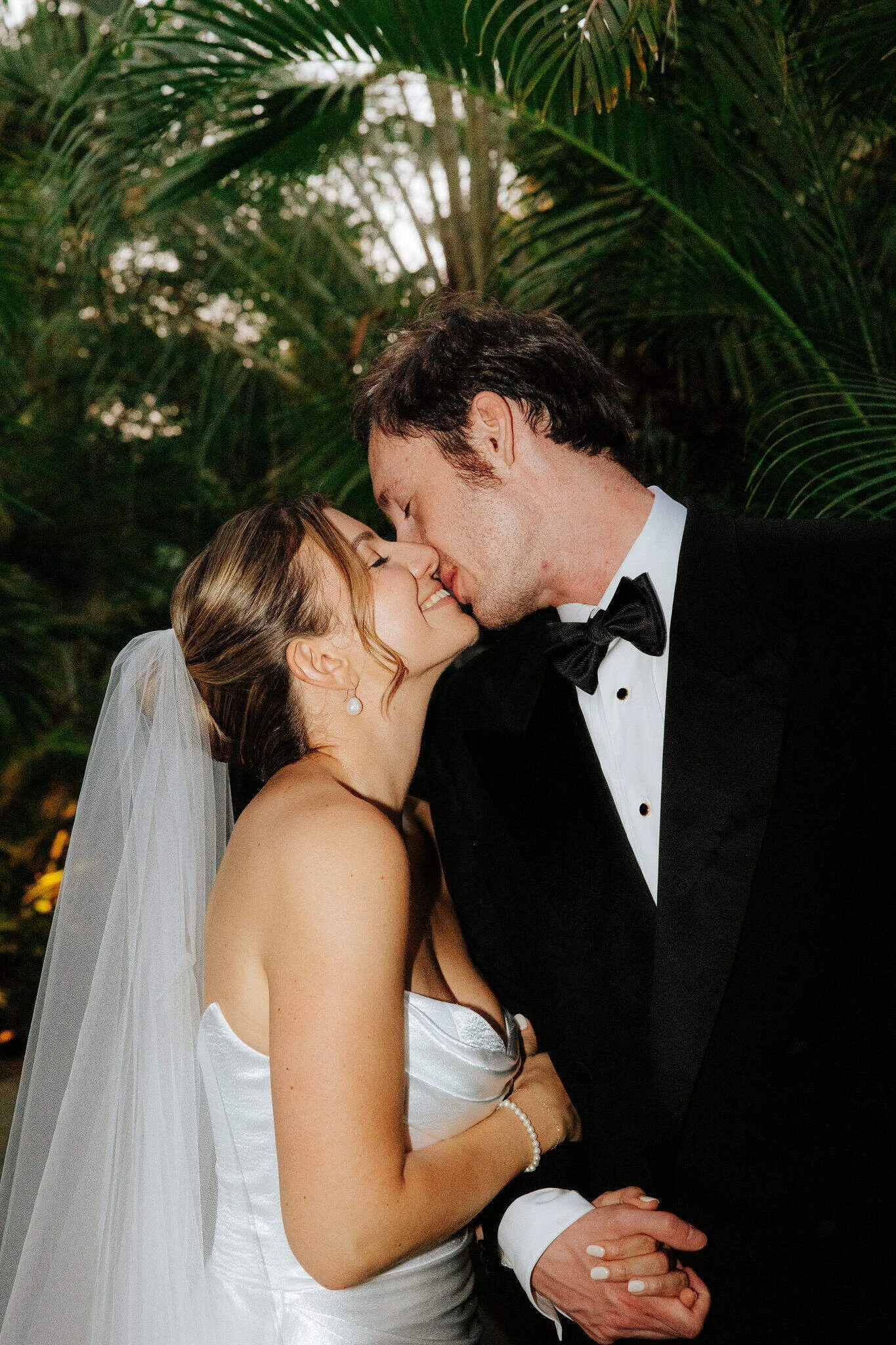 Bride and Groom Kissing at Golden Hour with Flash