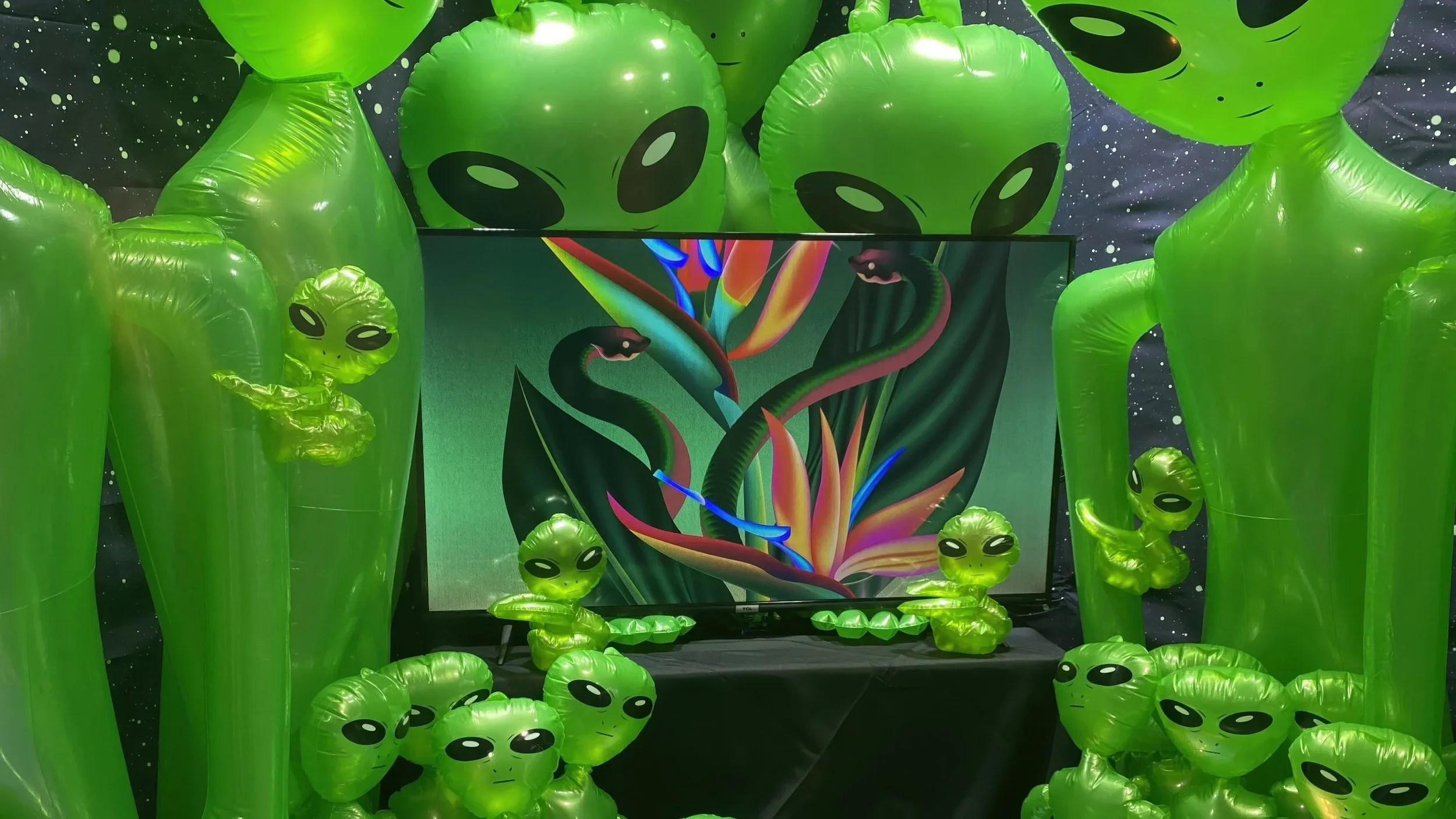 H+ Creative booth at ComplexCon 2021 featuring inflatable alien figures and digital art display