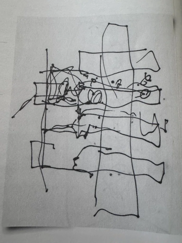 Frank Gehry drawing made with black marker on white serviette, featuring abstract and scribbled lines and shapes.