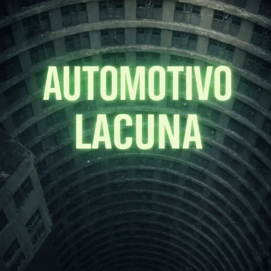 Neon sign reading 'Automotivo Lacuna' inside a building with curved, multi-level balcony architecture.