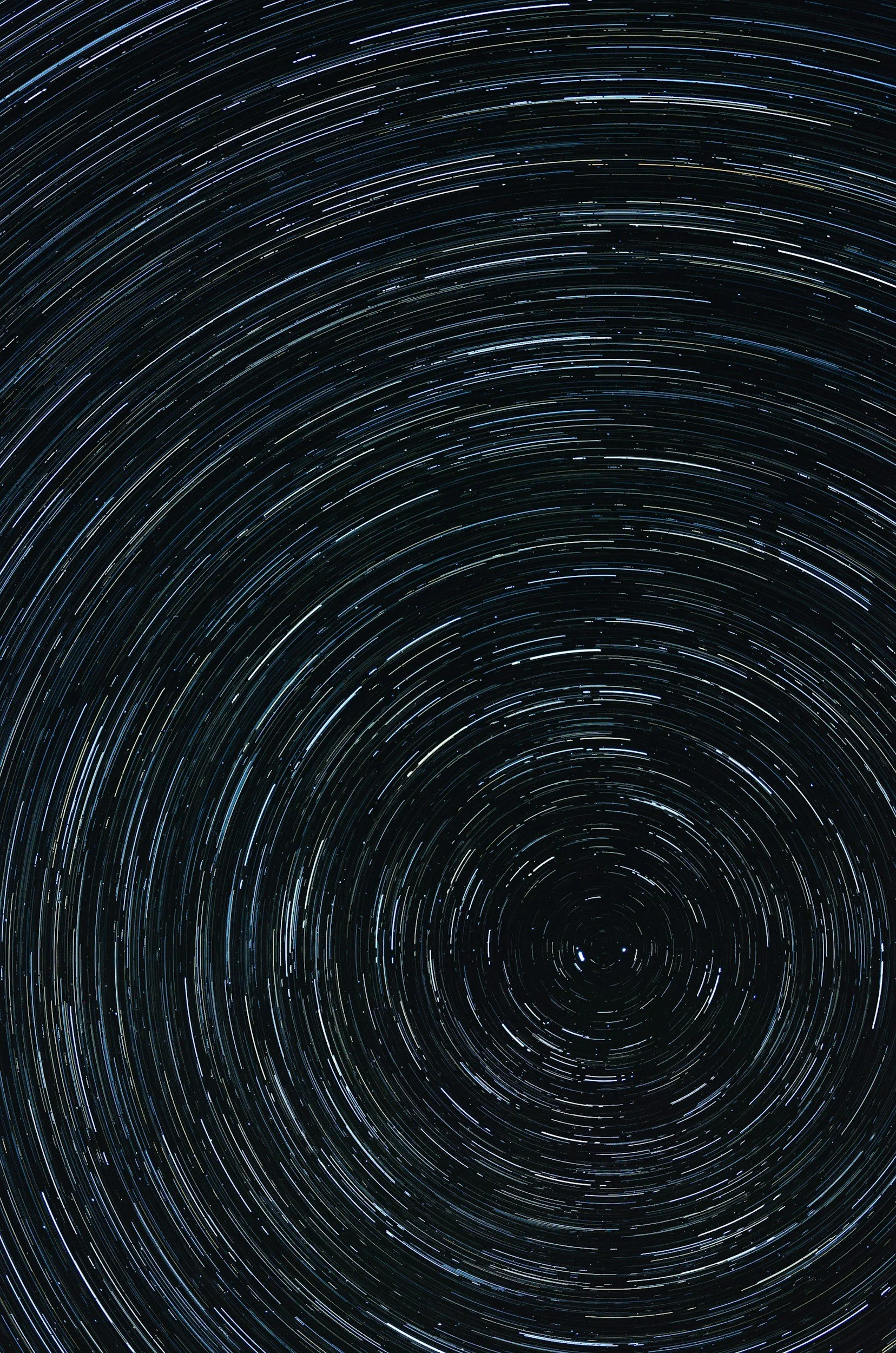 Star trails in the night sky showing circular motion due to long exposure photography.