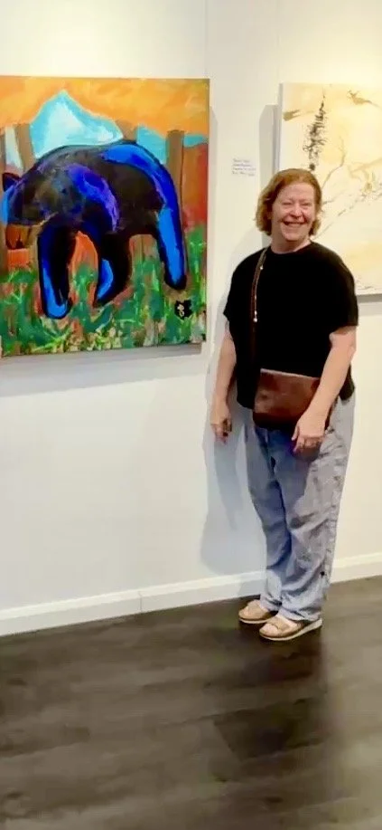 ArtCollective NSW supporter Wendy Jacobs, with a painting called Bear of Emotion, by young artist Jacob Beardow.