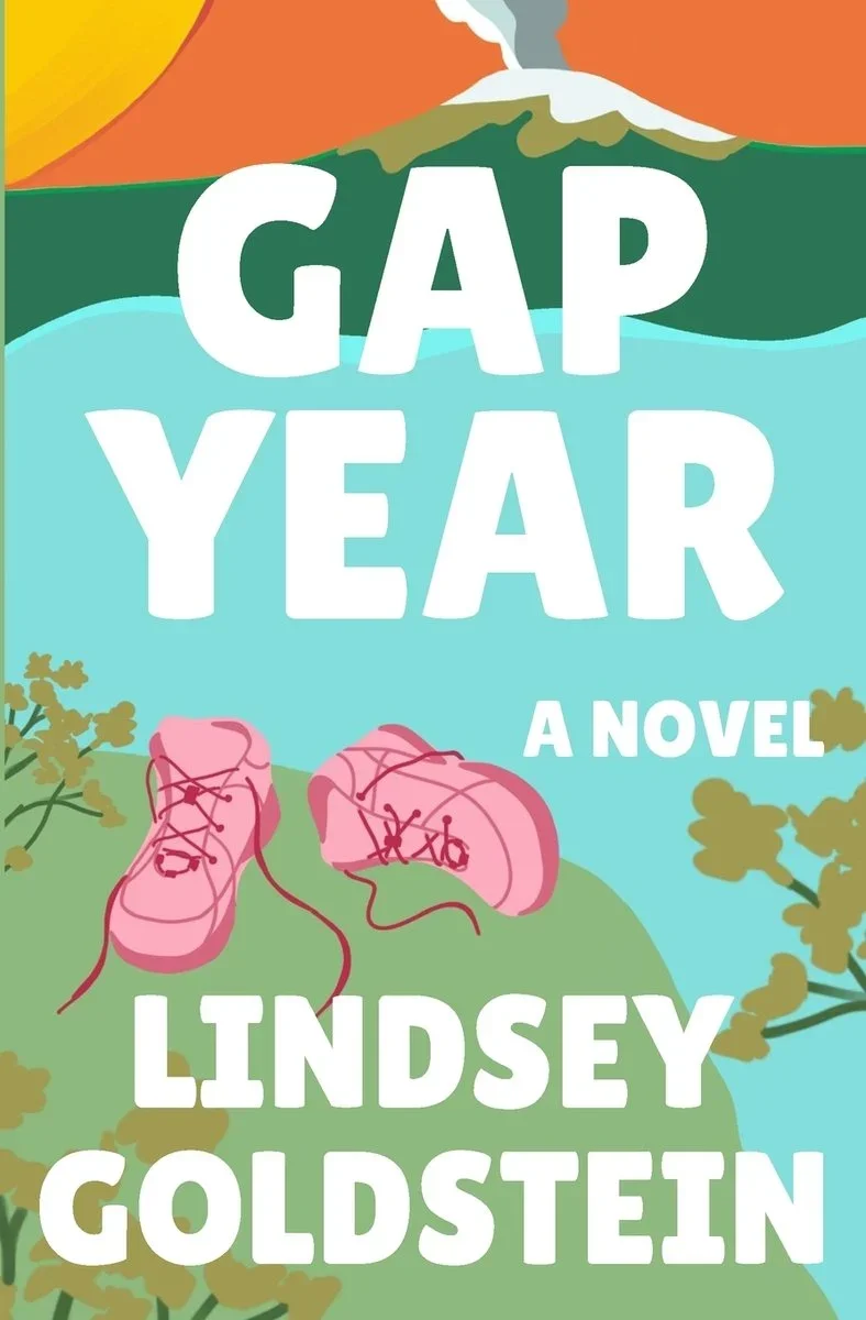 Book cover for 'Gap Year' by Lindsey Goldstein, featuring an illustration of pink sneakers on a grassy hill, with a lake, green trees, and mountains in the background.