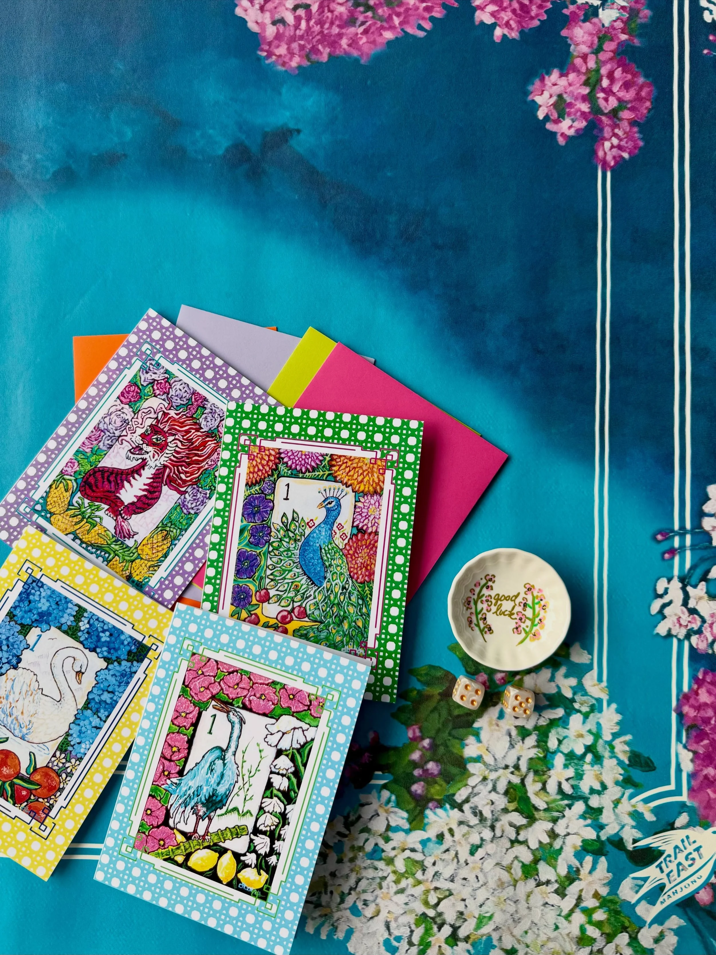 One lucky New Buffalo retreat attendee will be going home with a beautiful raffle bundle gifted by @traileastmahjong!! The Mahjong Mat, one-of-a-kind dice dish, and bright greeting cards are all designed by Michigan Artist Deb from @traileastmahjong.