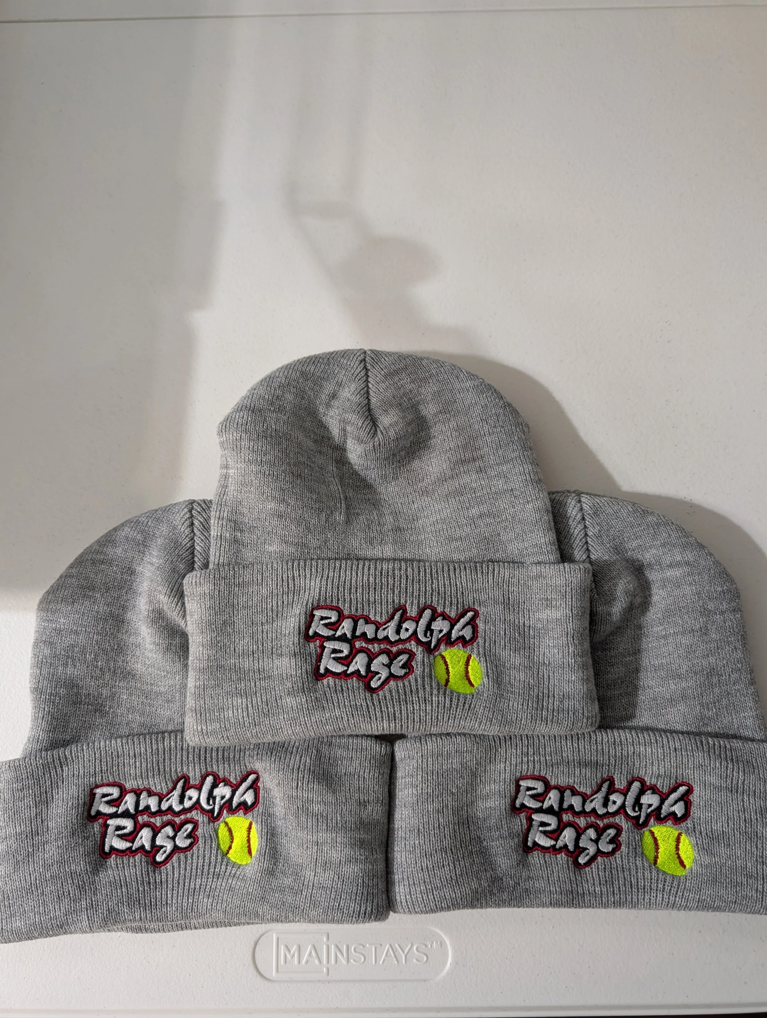 Gray knit beanie hats with embroidery that says "Rundog's Rage" and a yellow tennis ball logo.