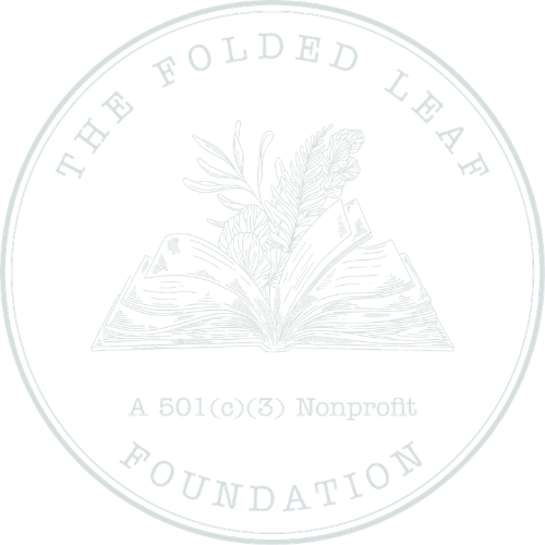Logo for The Folded Leaf Foundation featuring an open book with foliage and flowers emerging from it, with the foundation name and 501(c)(3) nonprofit designation surrounding the image.
