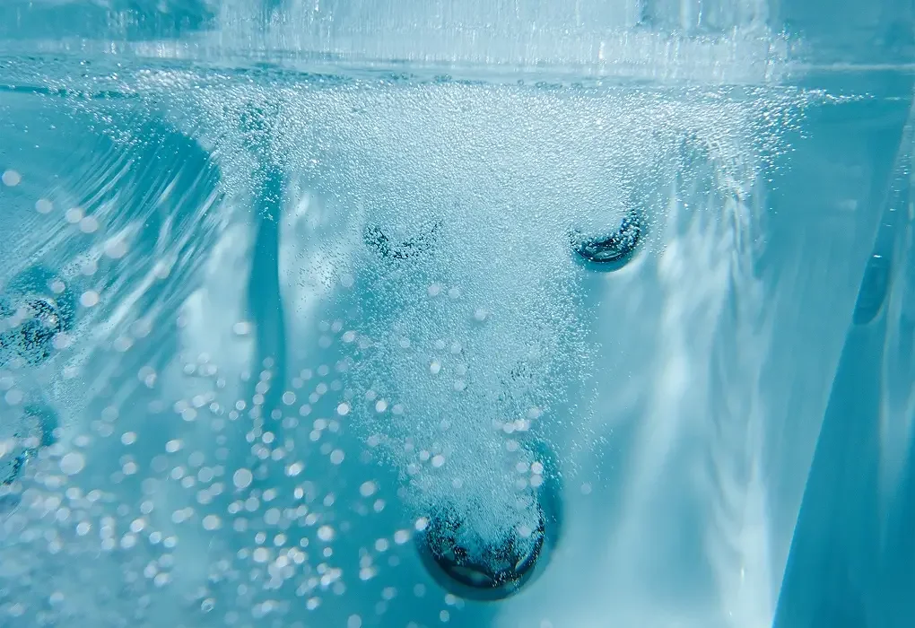 Cold clear water and rising bubbles seen from below the surface