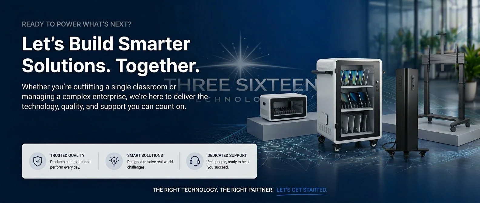 A digital advertisement with technology equipment including a white mini fridge, a black security device, and a monitor stand, set in a bright modern office environment with large windows and indoor plants.