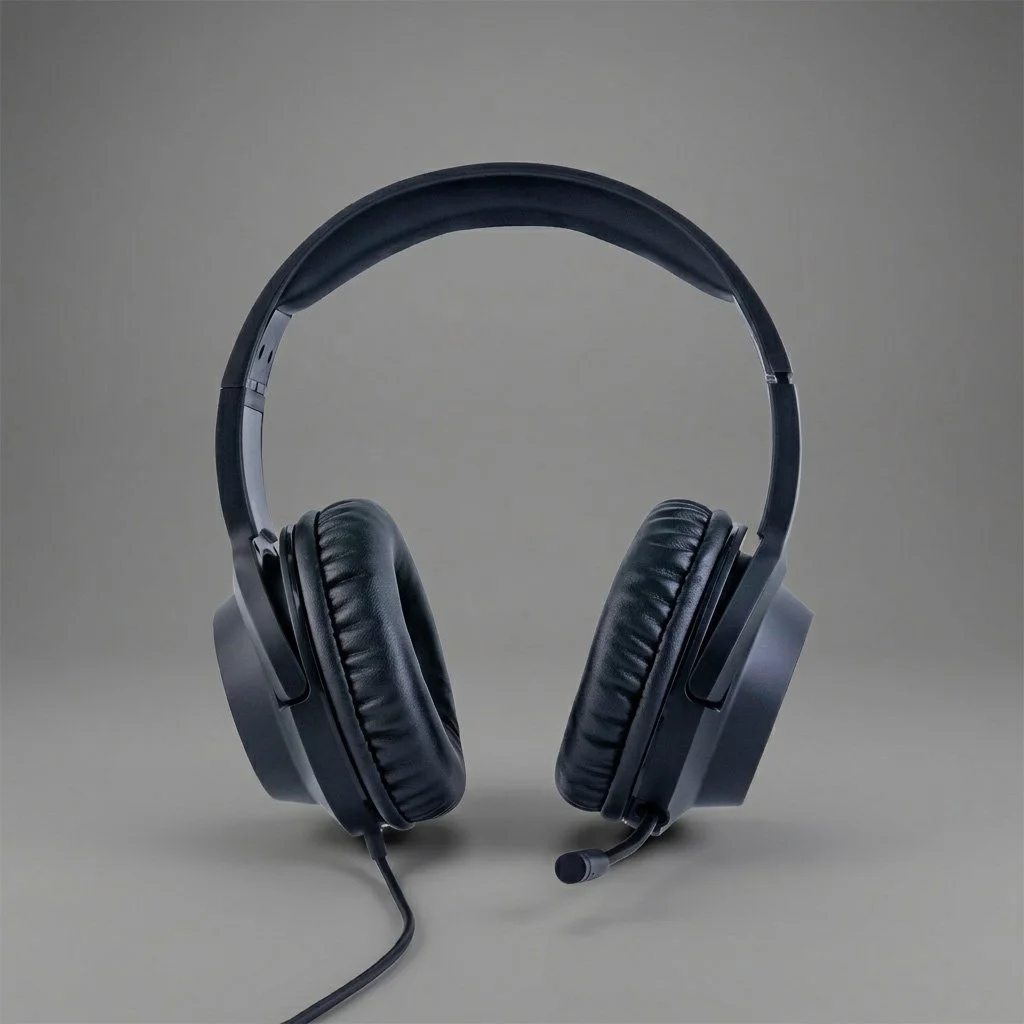 A black wired over-ear gaming headset with a microphone on a neutral background.