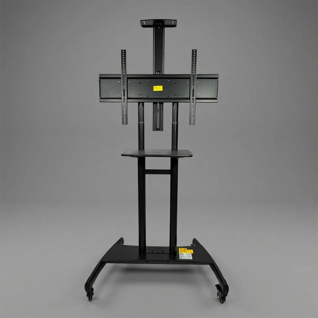 A black adjustable cart with a mounted flat screen TV bracket and a small platform, set against a plain gray background.