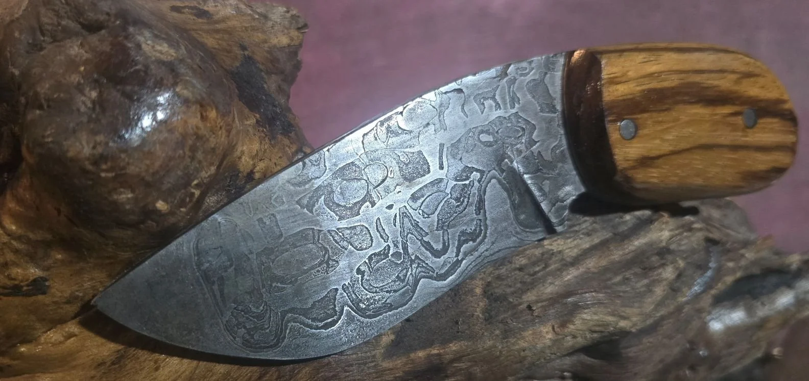 San Mai motorcycle chain and low layer Damascus. Zebra wood handle