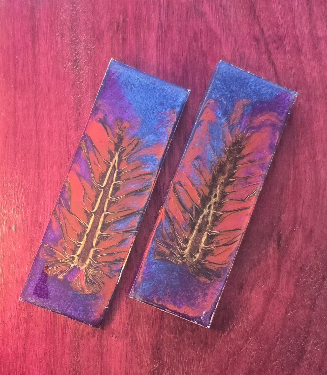 .4x2x6 inch pinecone surrounded by bright red in pearl purple and blue resin knife scale