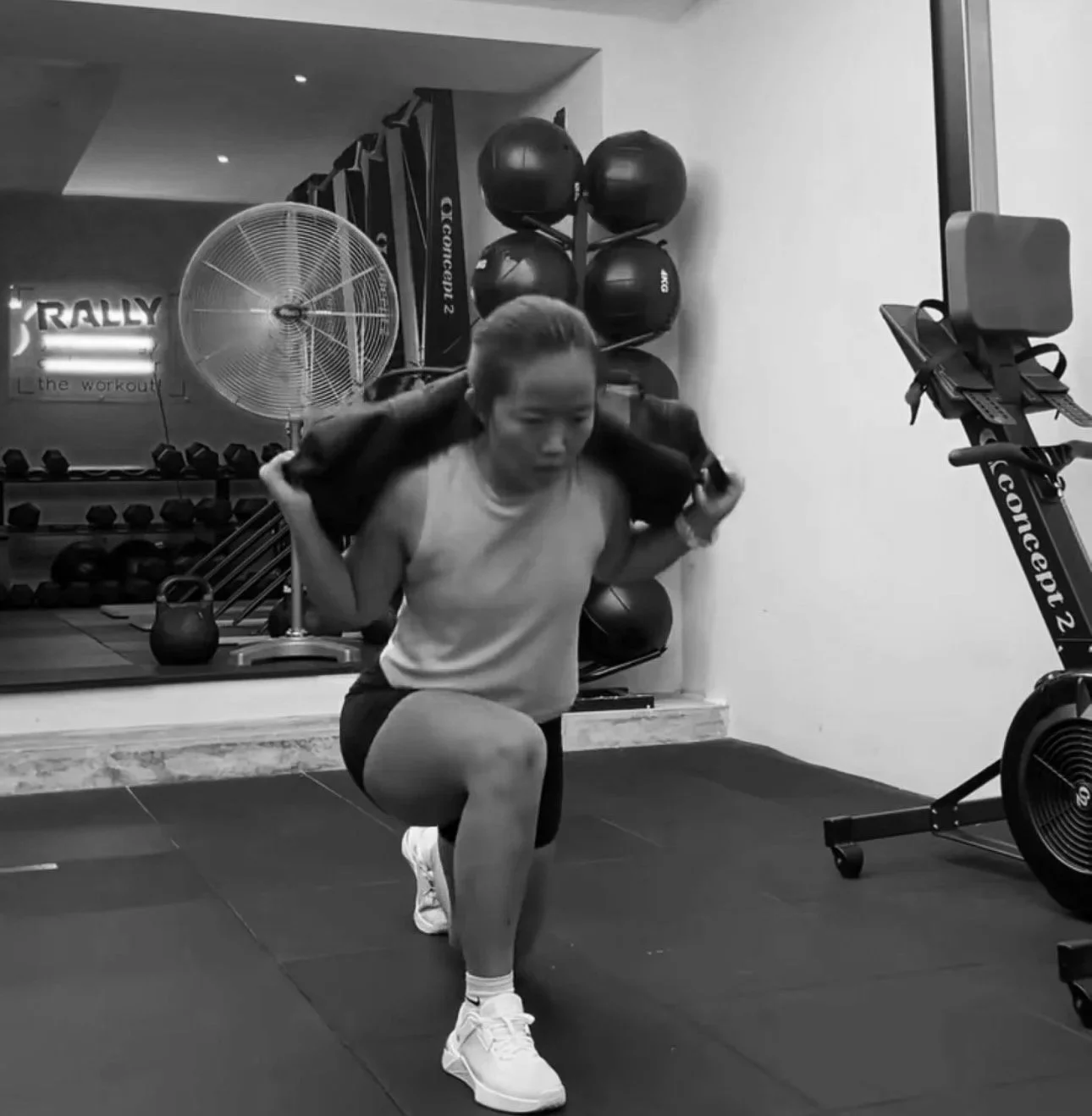 Member doing squat exercise during metabolic conditioning class in Balestier Singapore gym