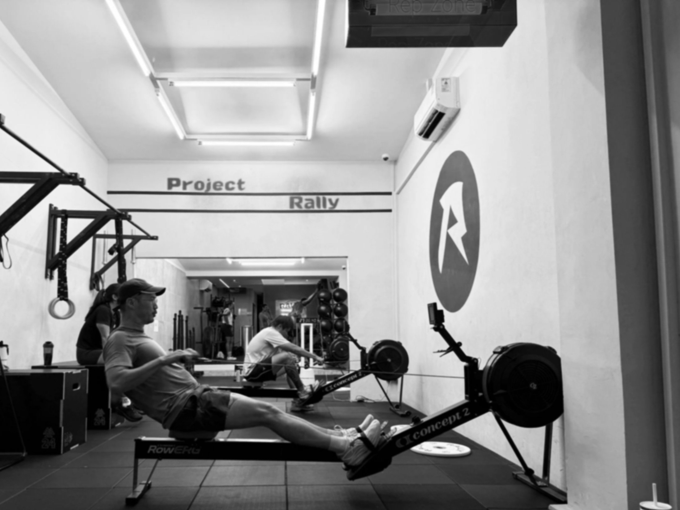 Group performing rowing intervals in a Nitro fitness class at a Balestier Singapore hybrid training gym