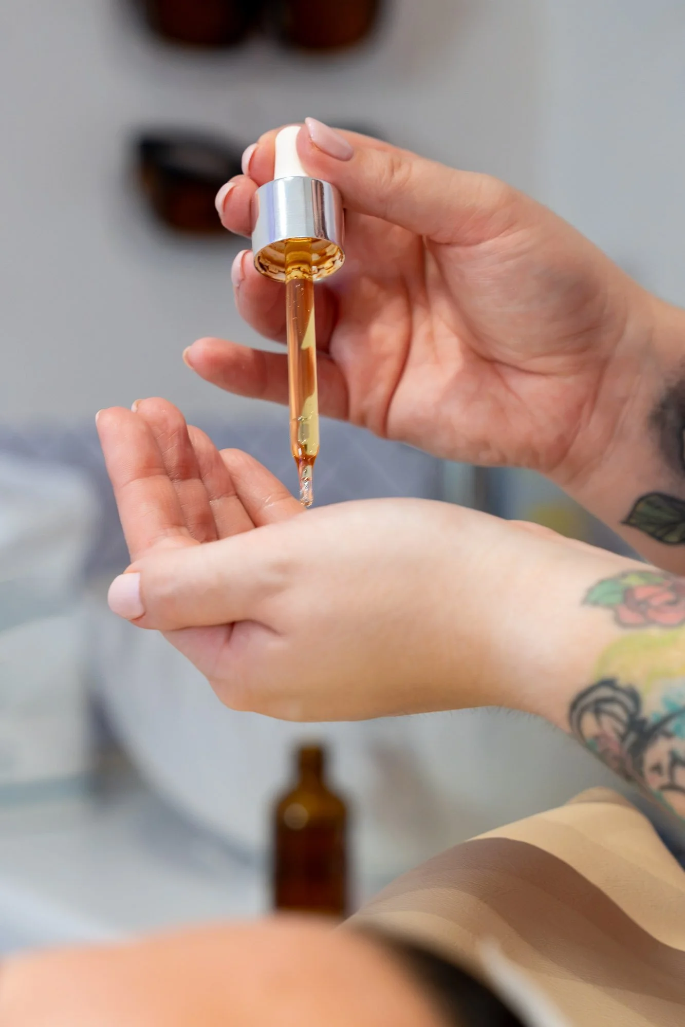 Professional skincare serum dispensed from a dropper at SkinFirst skin clinic in Warrington