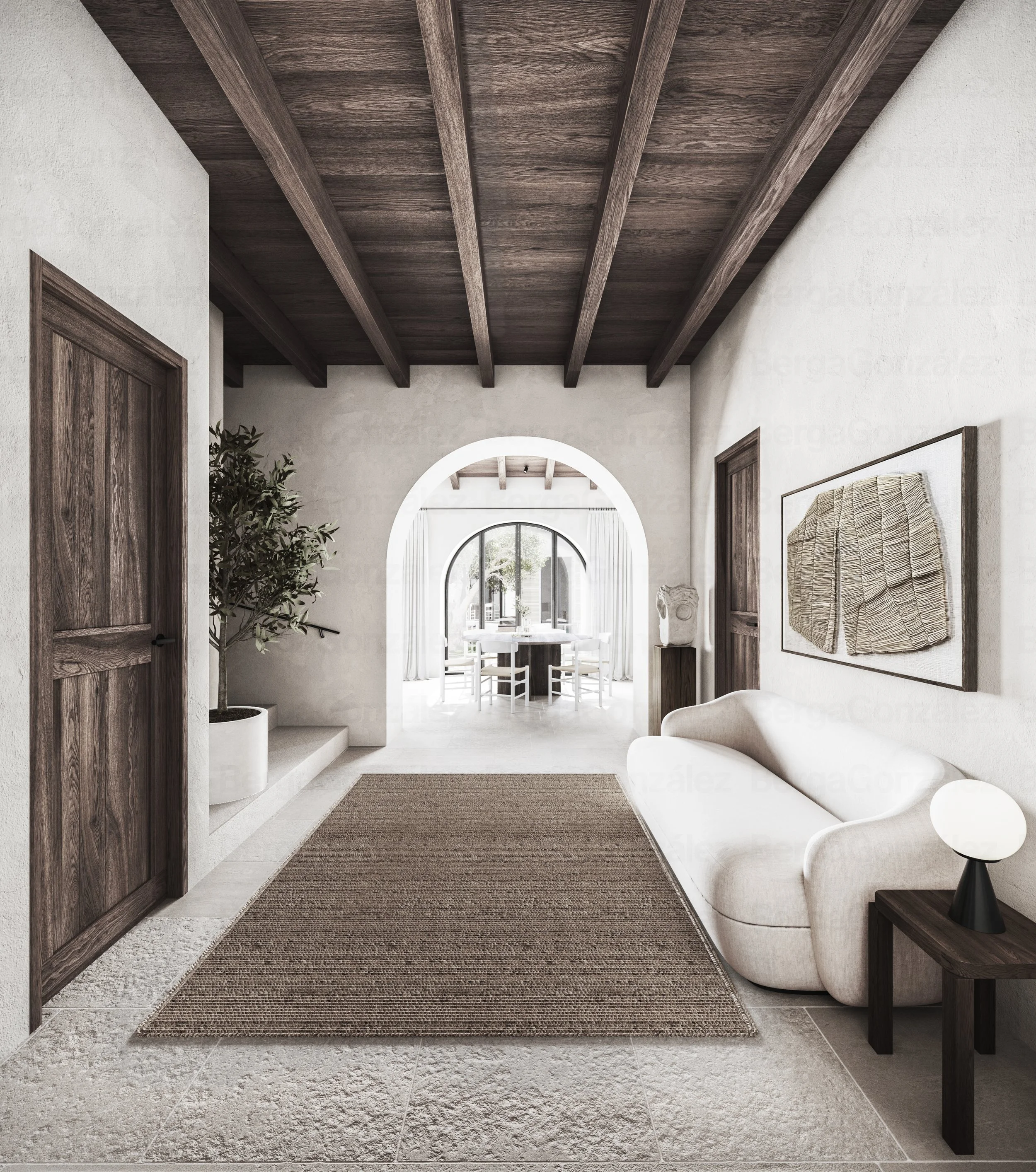 A modern, minimalist home interior with white walls, wooden doors, a beige rug, a white sofa, a side table with a round lamp, a potted plant, and artwork on the wall. Visible archways lead to a dining area with large windows and white curtains.