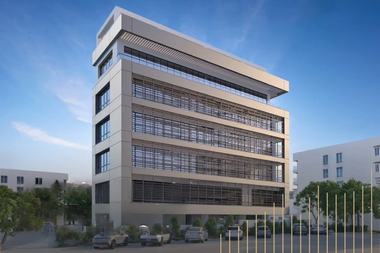 Modern multi-story office building with horizontal shaded window panels, surrounded by parked cars and trees, under a clear blue sky.