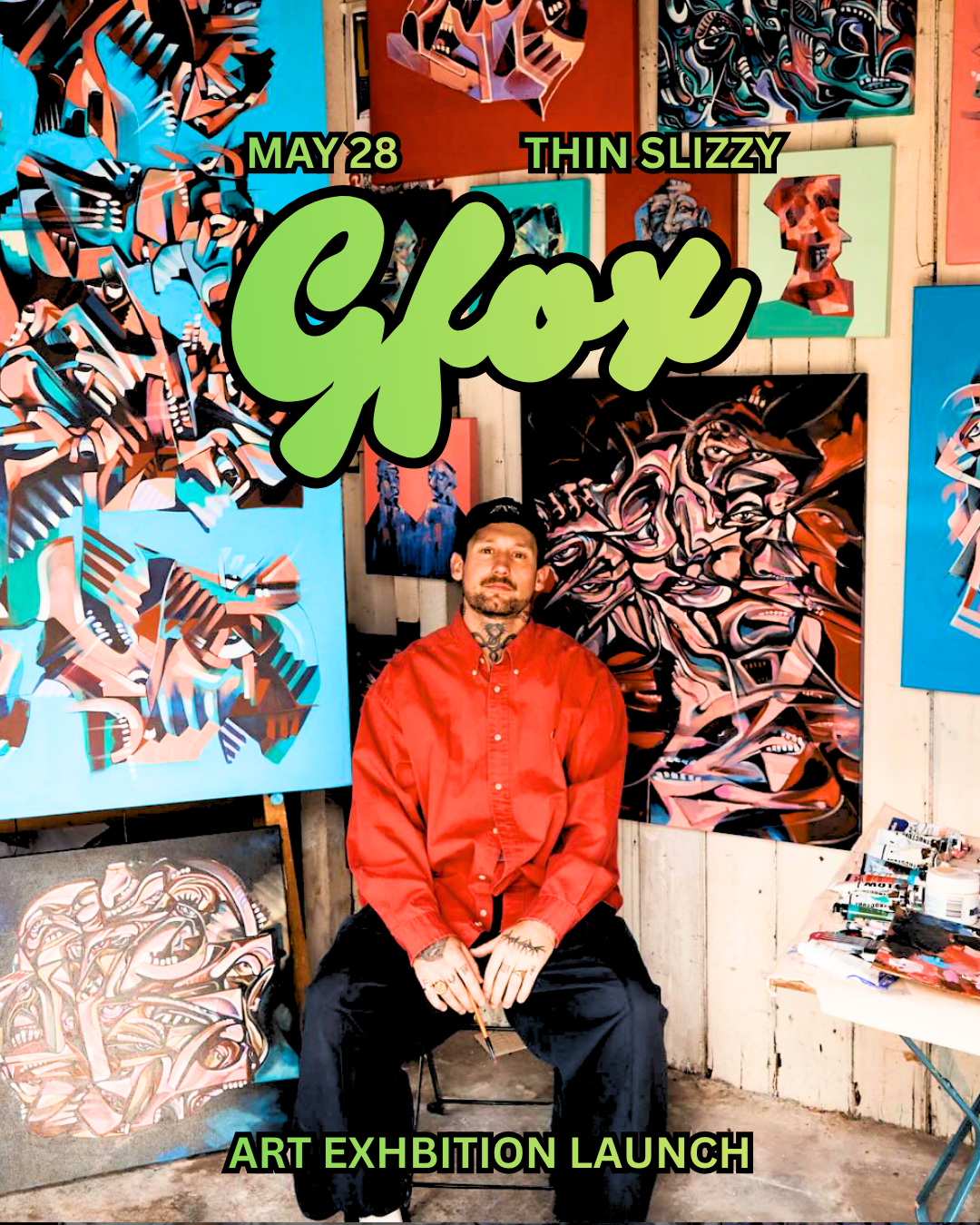 Man sitting in front of abstract colorful paintings at art exhibition with text about an art exhibition launch on May 28 by Thin Slizzy.