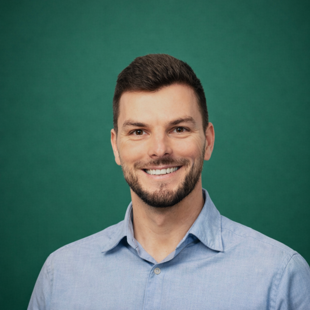 Headshot of smiling female tutor with short blonde hair wearing a lanyard.