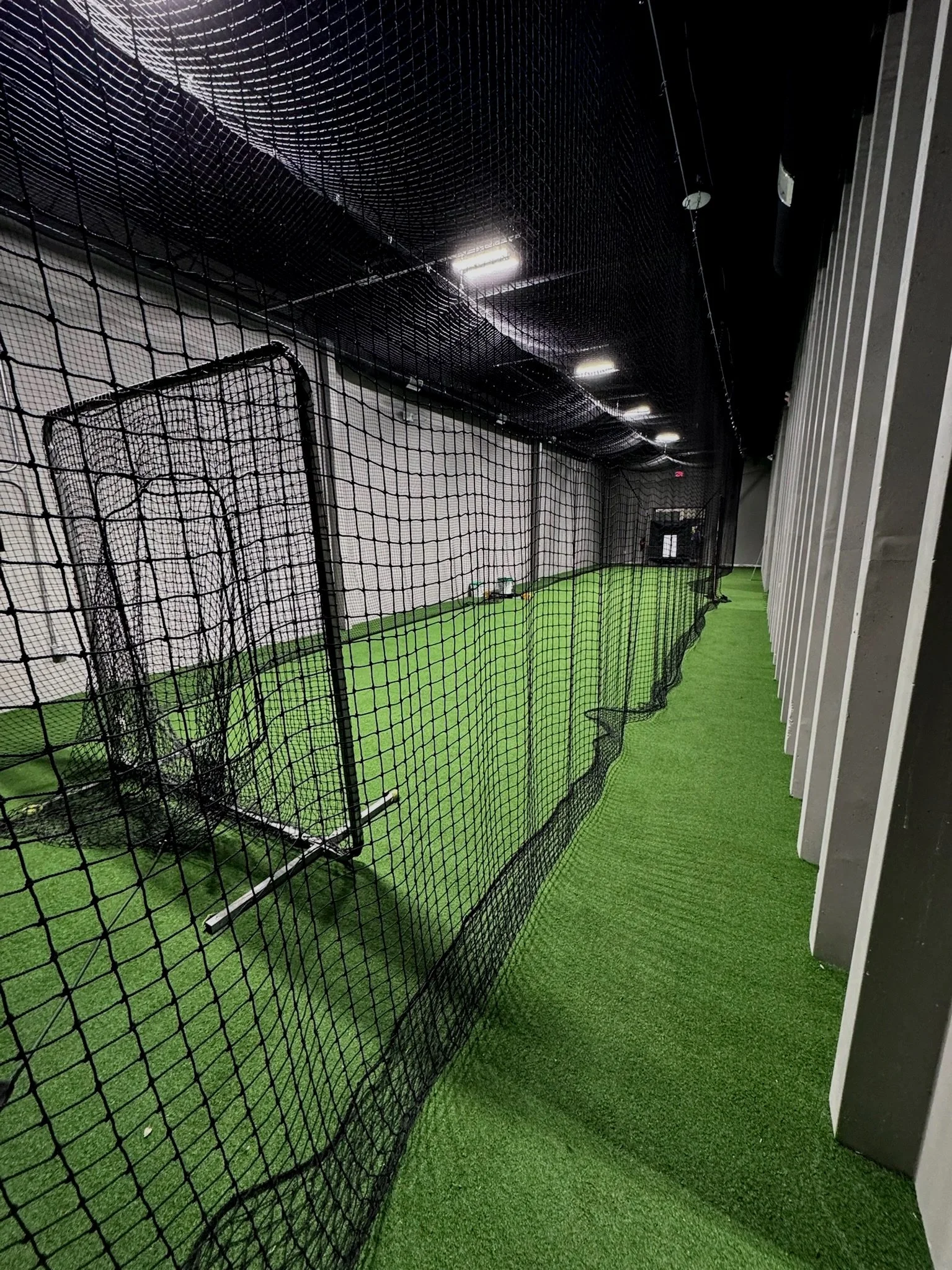 Empty batting cage with all tools.