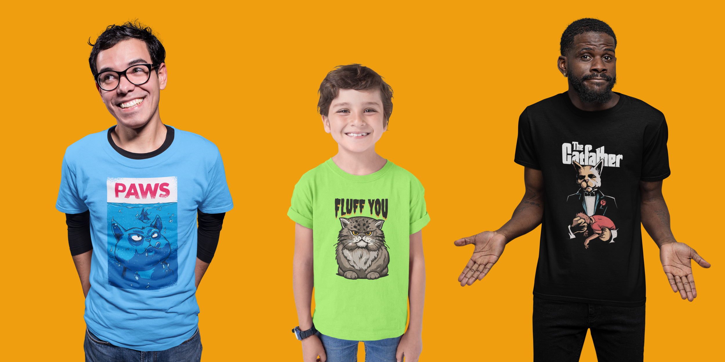 Three young men standing against an orange background, each wearing a colorful t-shirt with graphic designs. The first man on the left has glasses and a blue t-shirt with a cartoon dog and the word "PAWS." The middle man has short hair and a green t-shirt with a cat and the words "FLUFF YOU." The third man on the right has a beard and a black t-shirt with a cartoon character and the words "The Godfather."