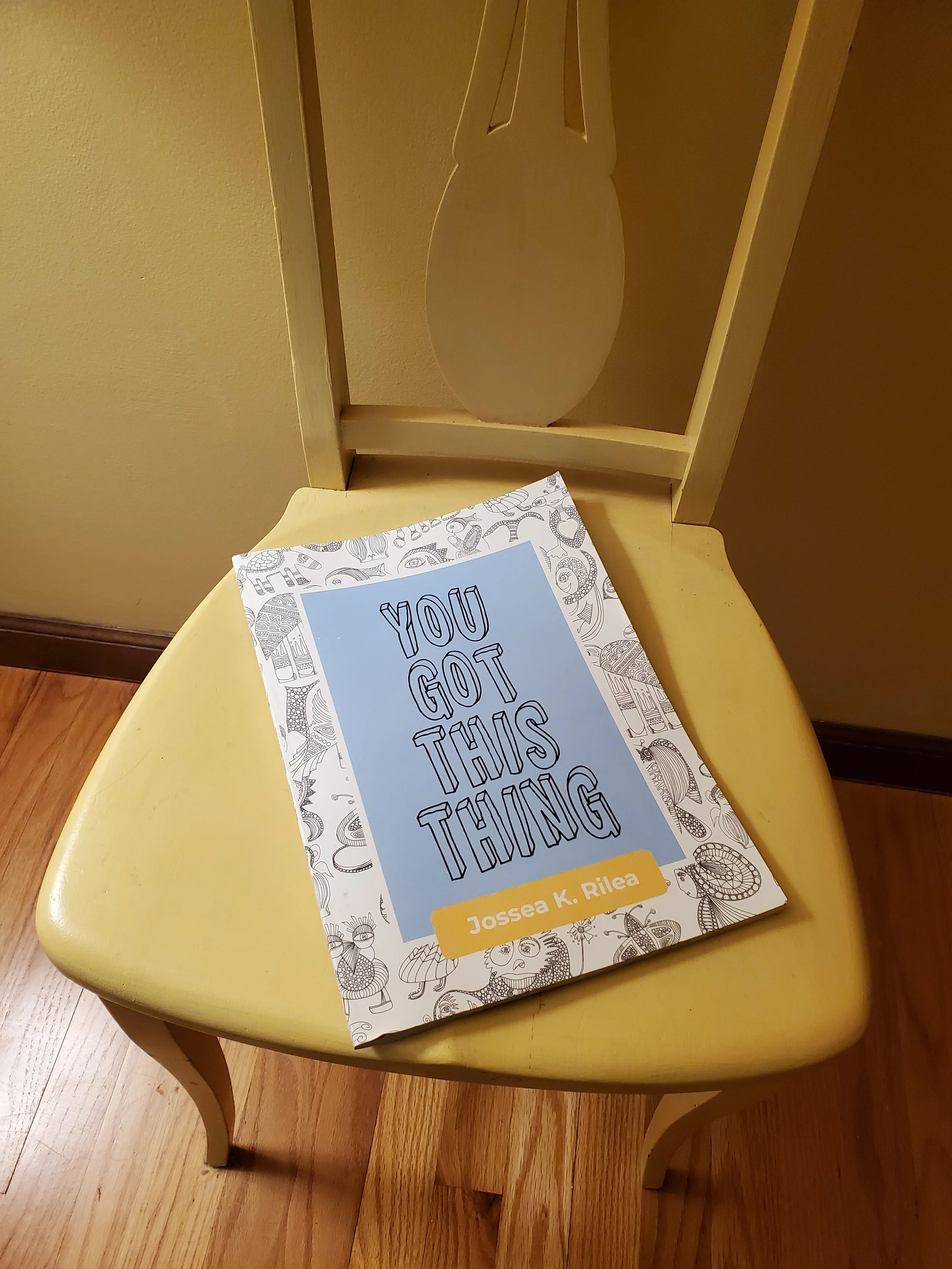 Image of the book You Got This Thing on a yellow chair.