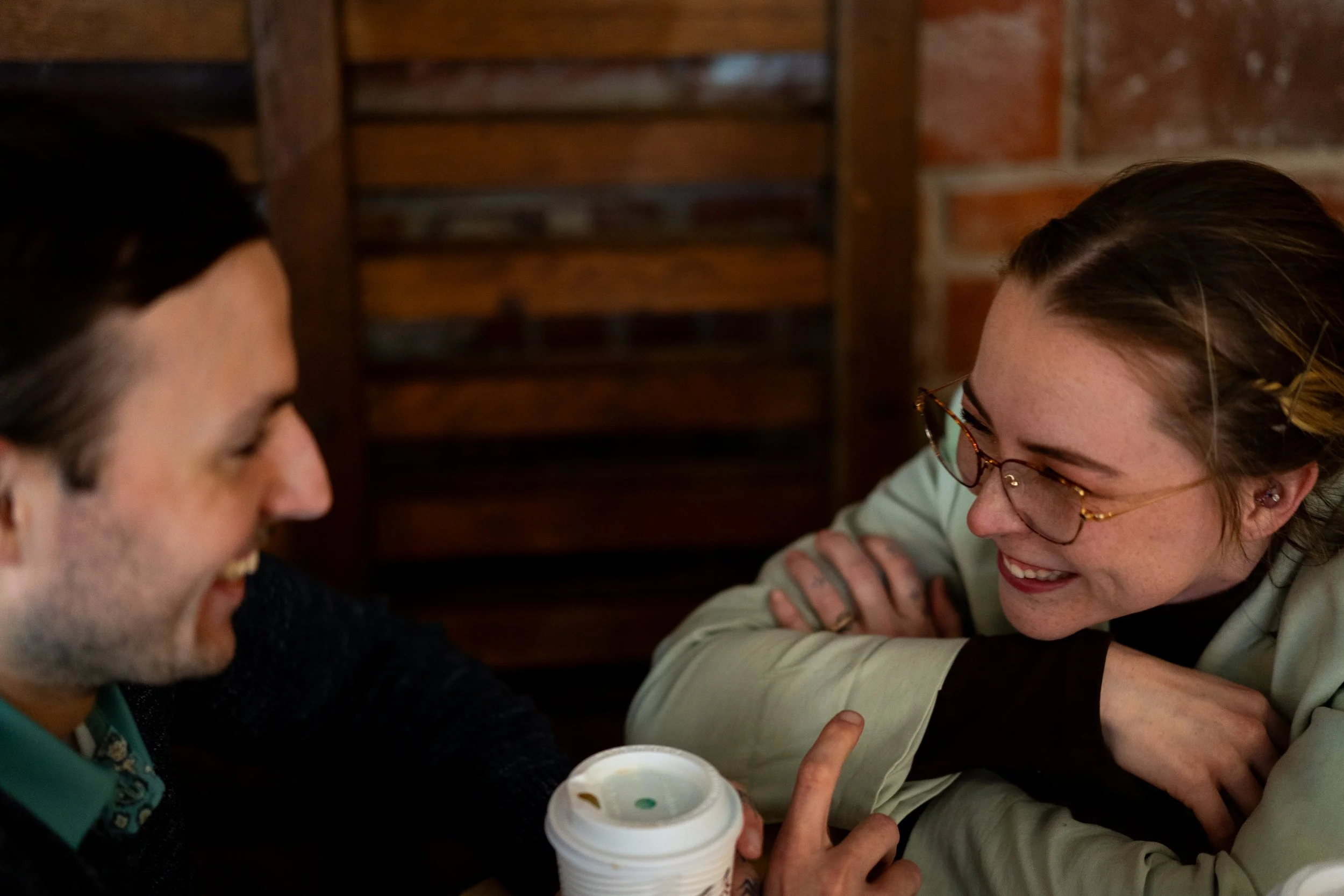 Couple laughing over coffee