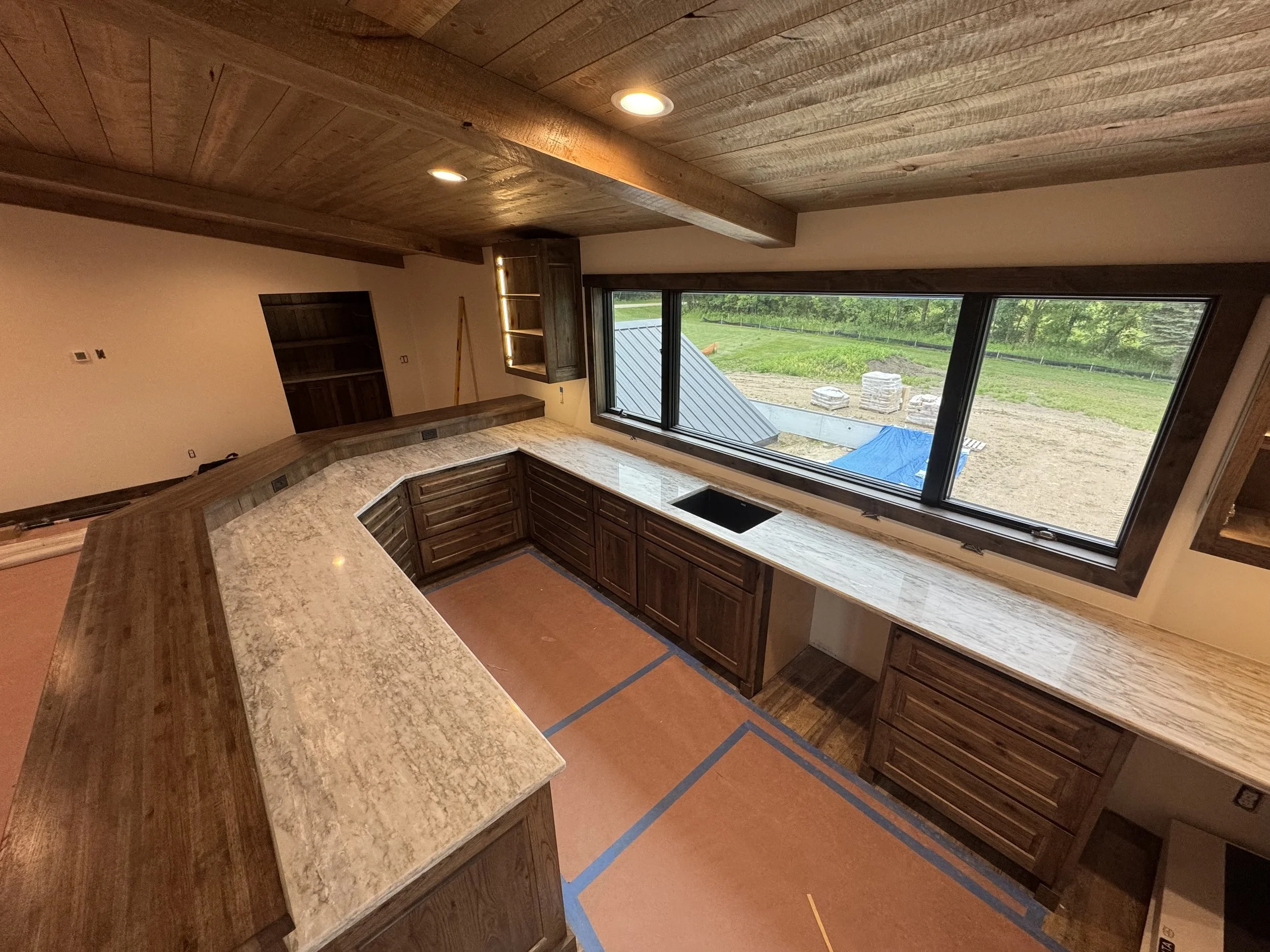 61 sprengeler-construction-custom-home-bar-area-rustic-wood-cabinetry.jpeg