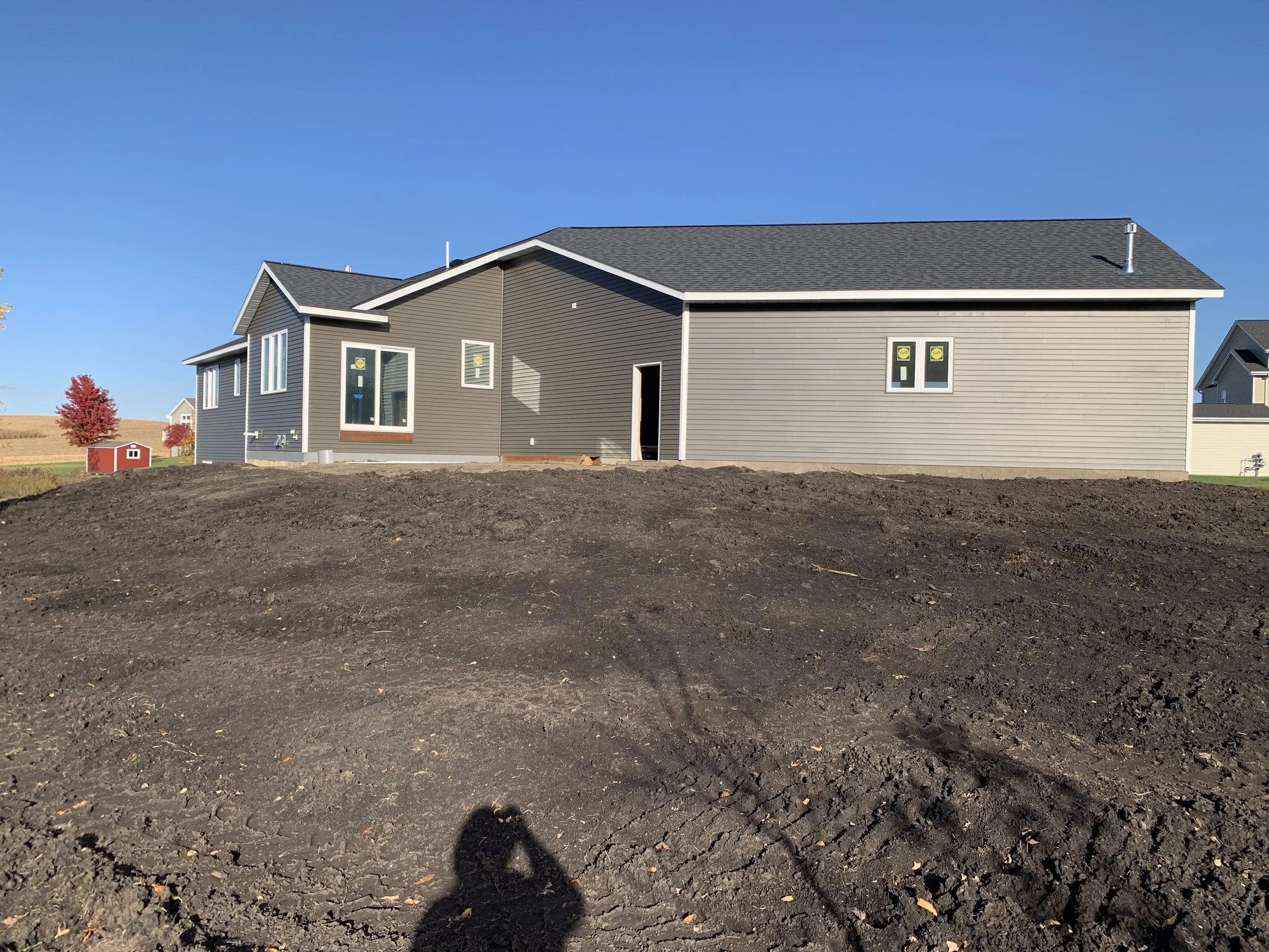 12 sprengeler-construction-home-side-elevation-new-build-siding-progress.jpeg