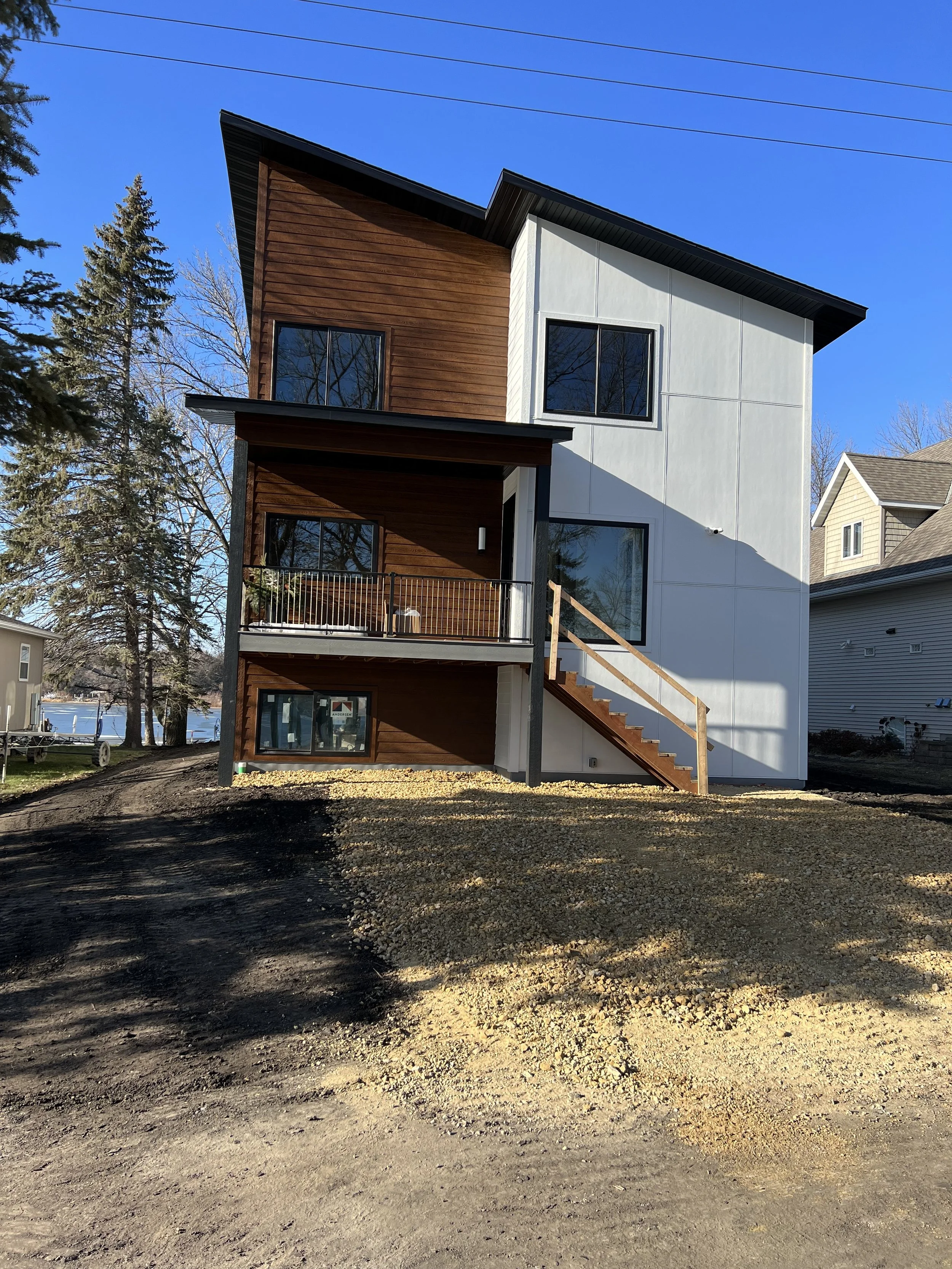 1 modern-home-exterior-angle-view-landscaping-gravel-finish.jpeg