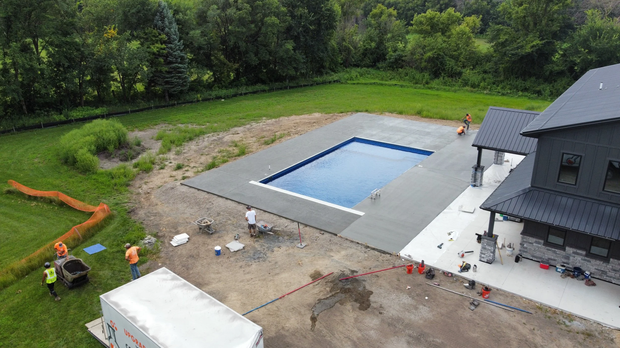 38 sprengeler-construction-concrete-pool-deck-finishing-crew.JPG