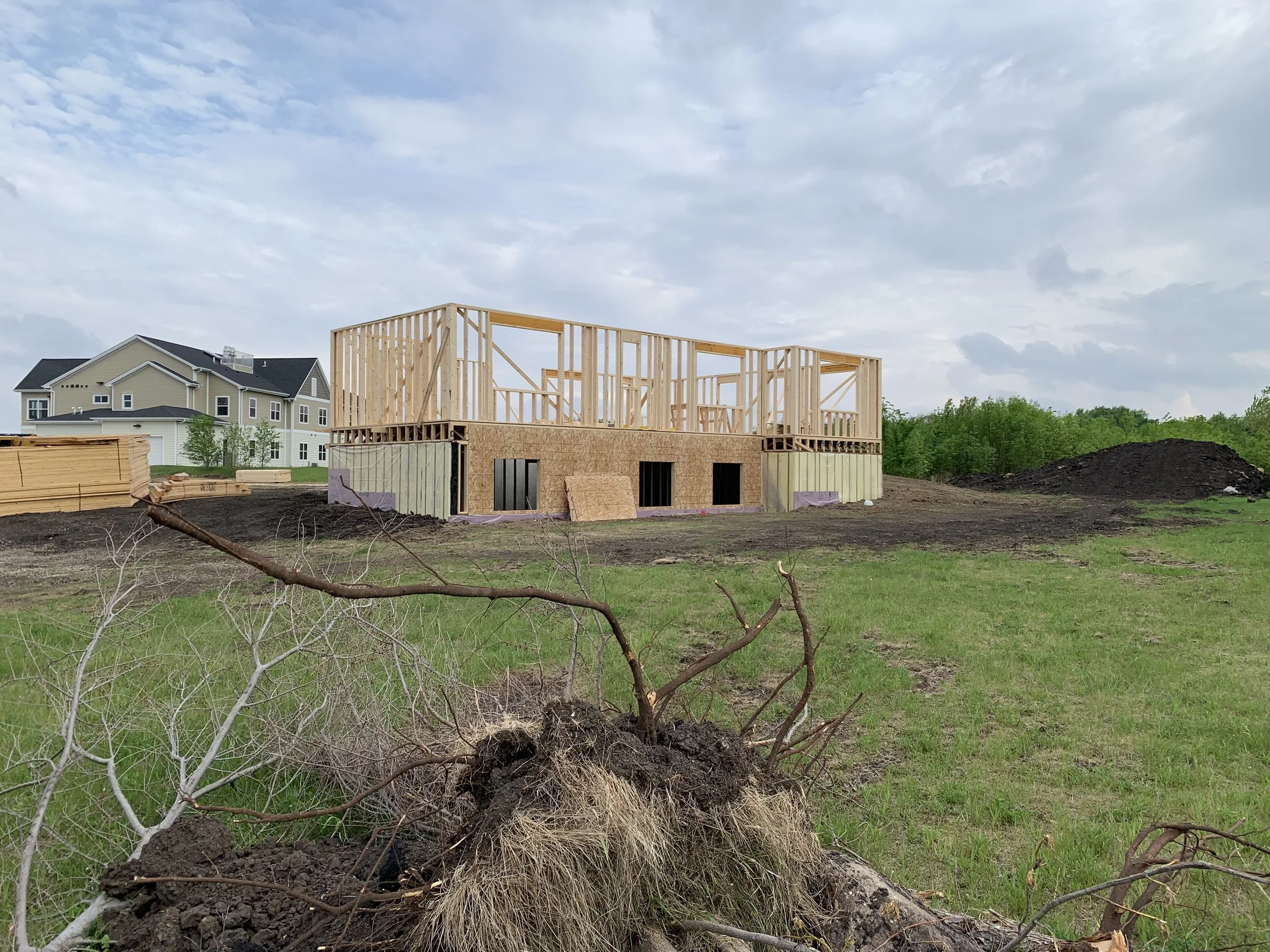 8 sprengeler-construction-home-framing-progress-roof-trusses-installed.jpeg