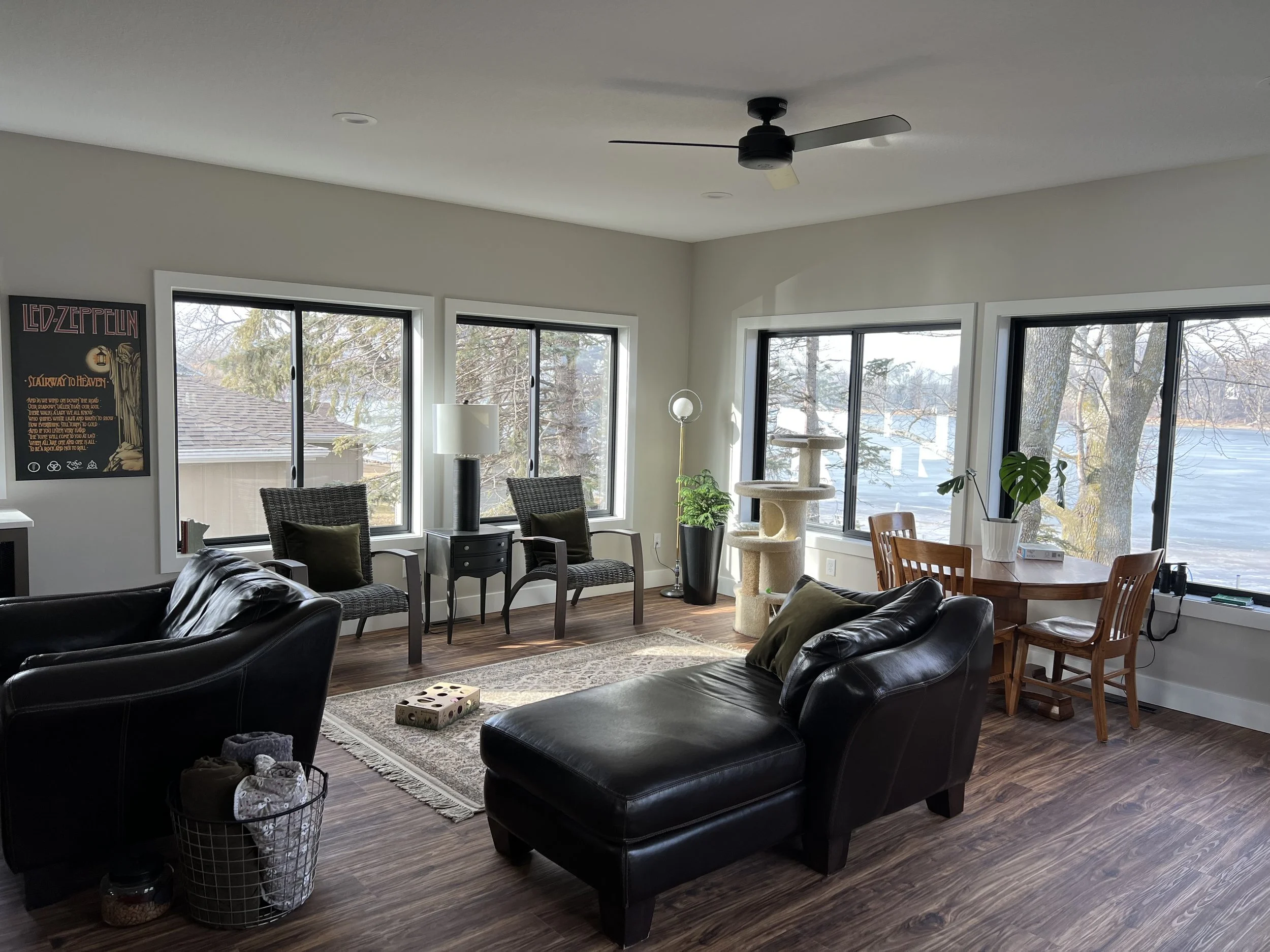 15 modern-lakeside-living-room-large-windows-water-view-seating-area.jpeg