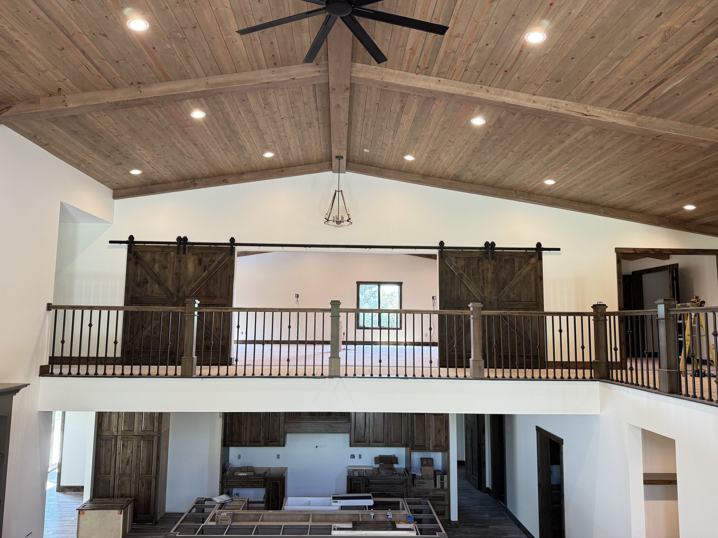 62 sprengeler-construction-vaulted-ceiling-loft-barn-doors-open-concept.jpeg