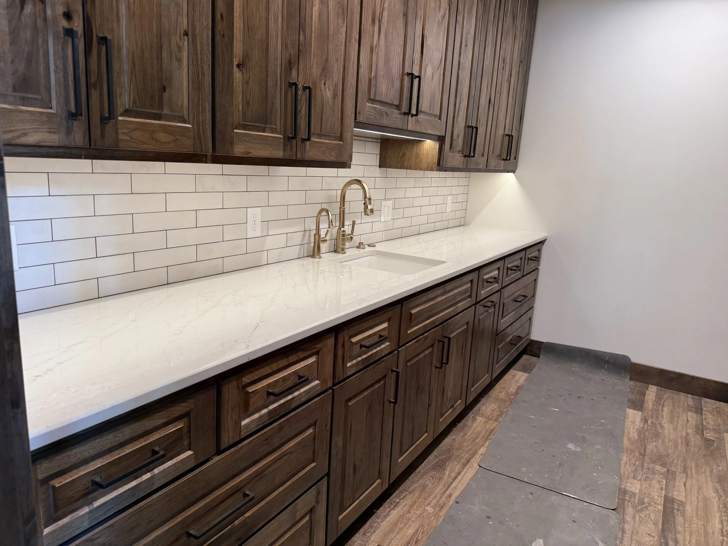 54 sprengeler-construction-custom-cabinetry-laundry-room-quartz.jpeg