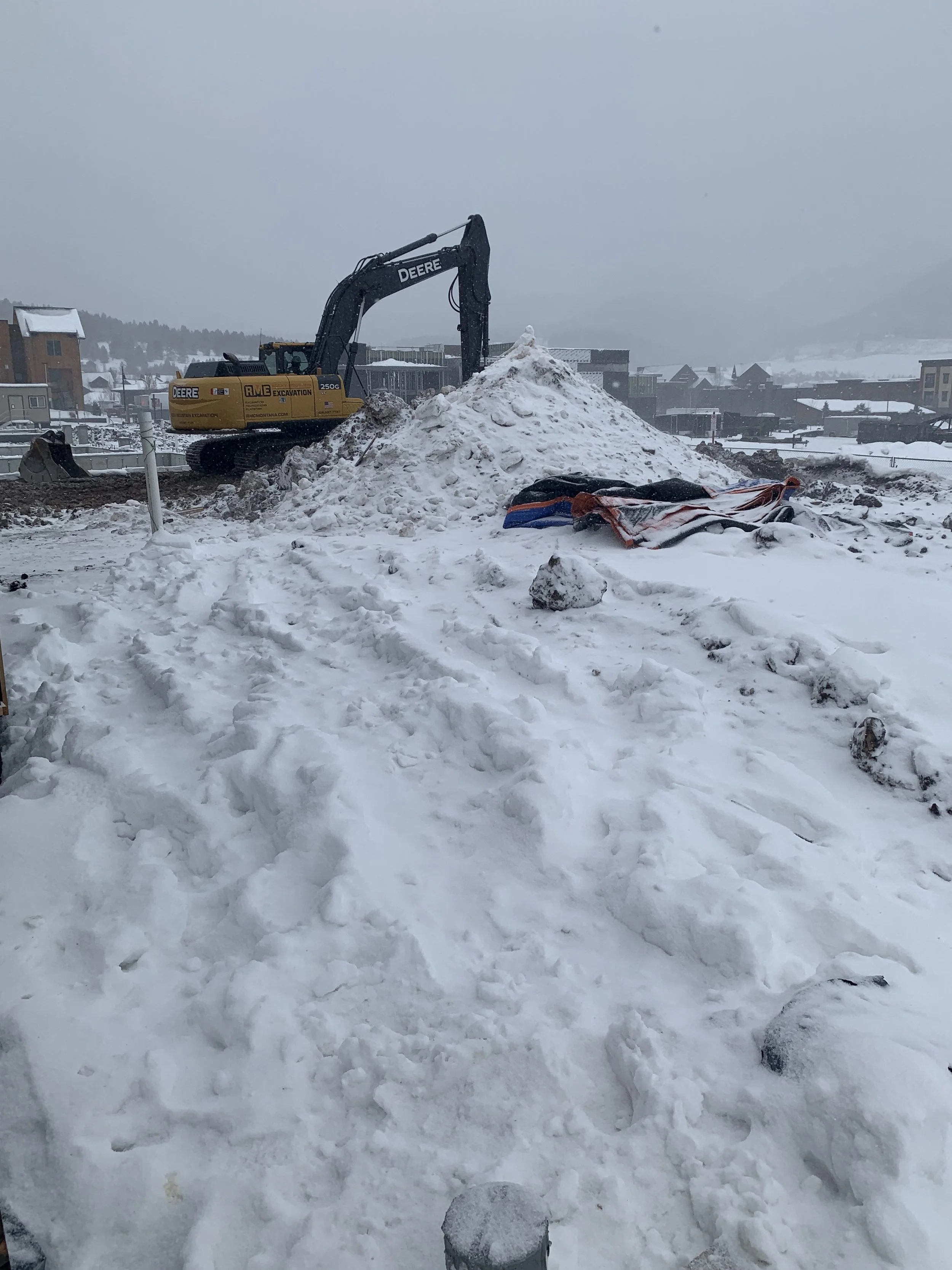 sprengeler-construction-excavation-site-winter-heavy-equipment.jpeg