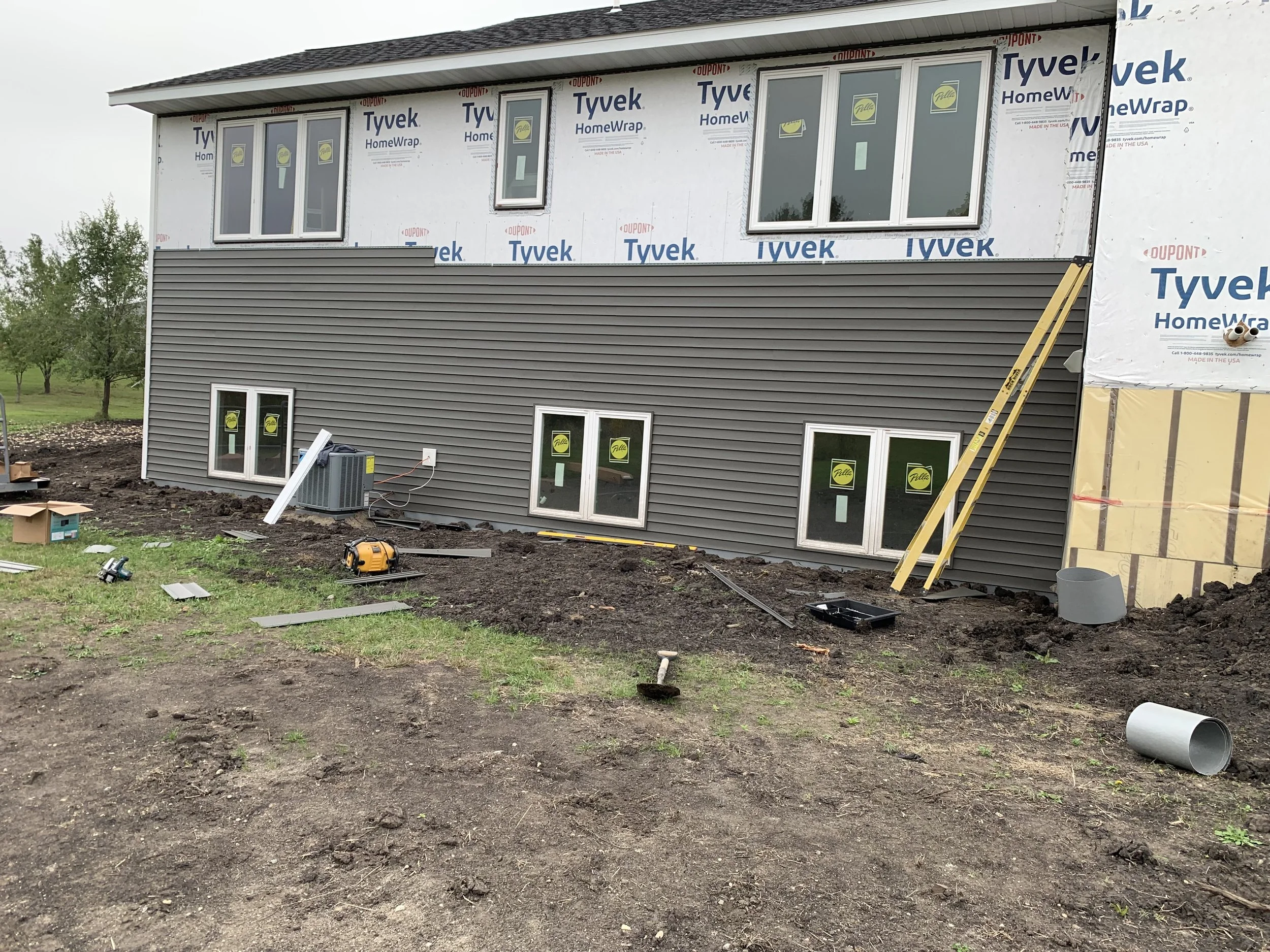 11 sprengeler-construction-basement-windows-siding-installation-progress.jpeg