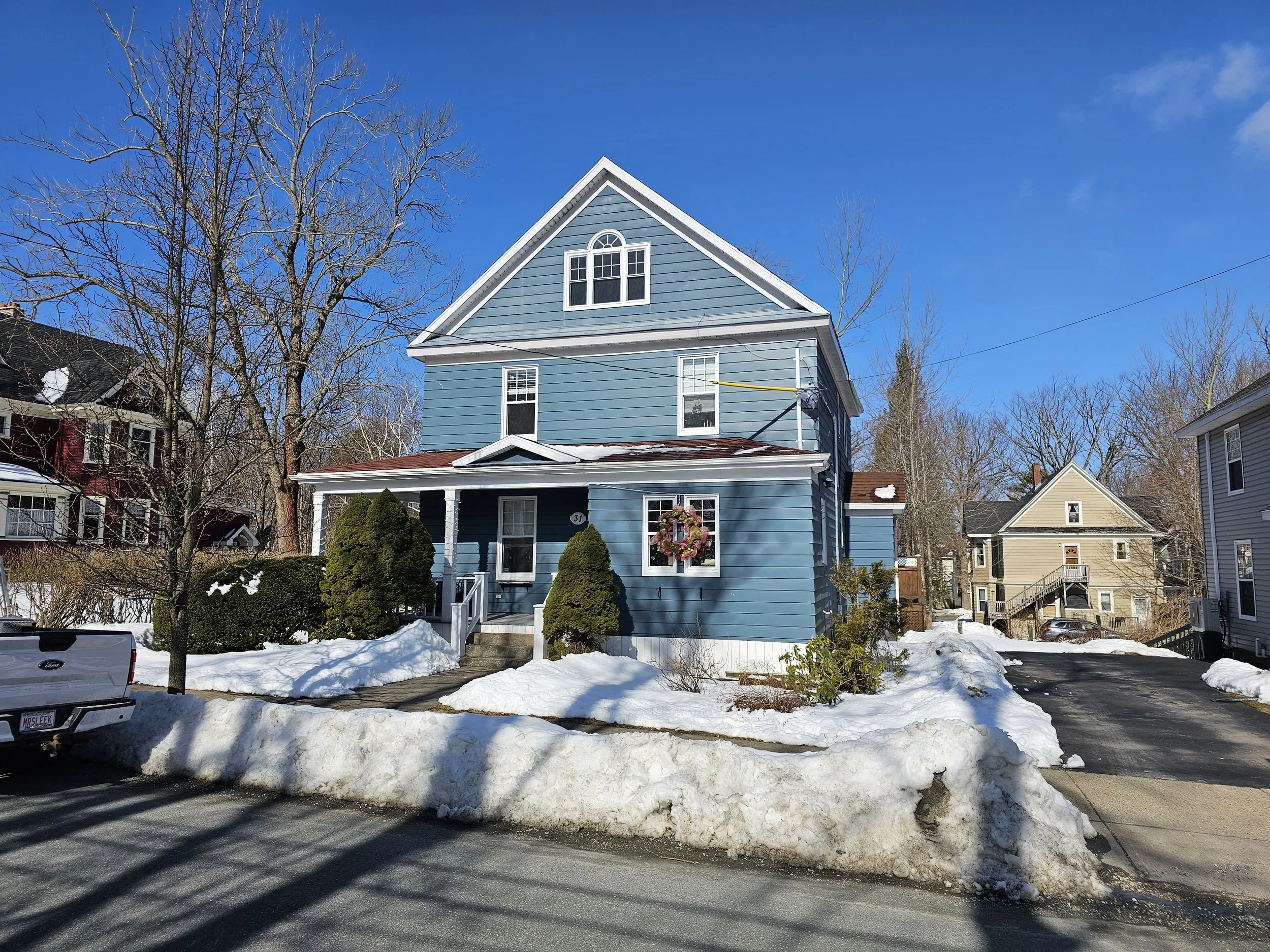 Before (Aluminum siding over original cedar shake siding)
