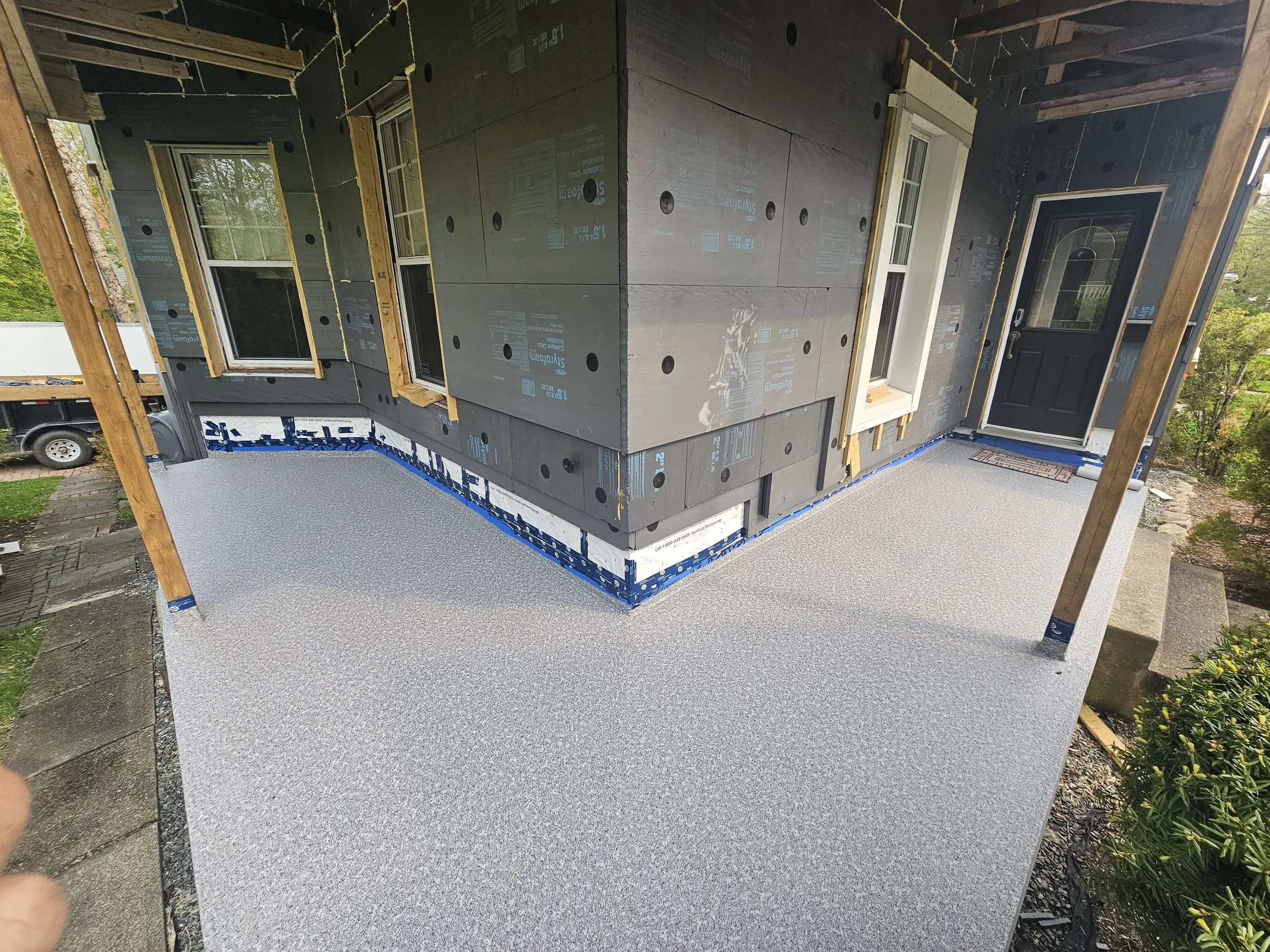 New vinyl deck membrane. No more splinters, no more painting or sealing.  Easy to clean and nice to look at.