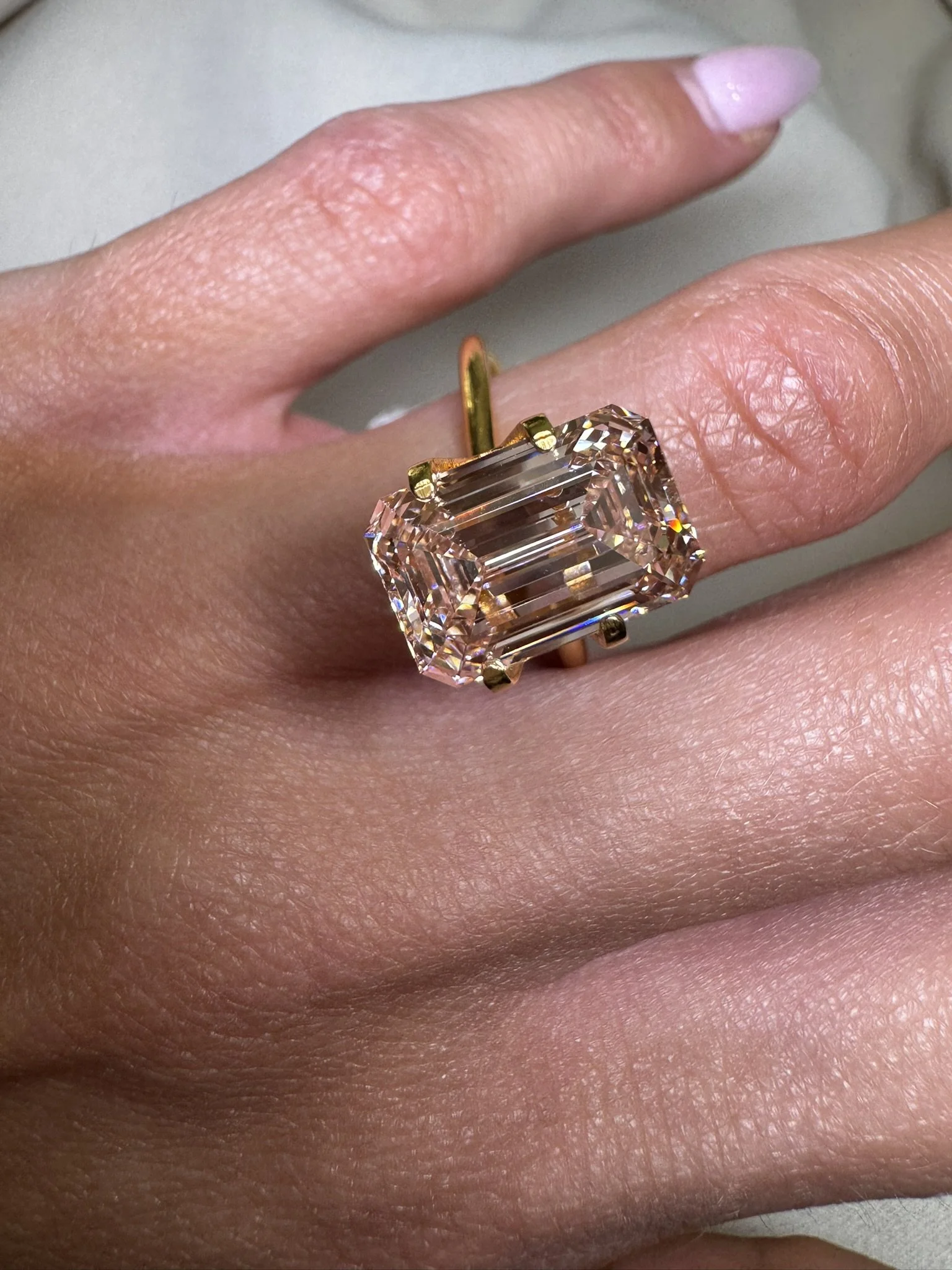 5.04 carat emerald cut diamond - light pink champagne
