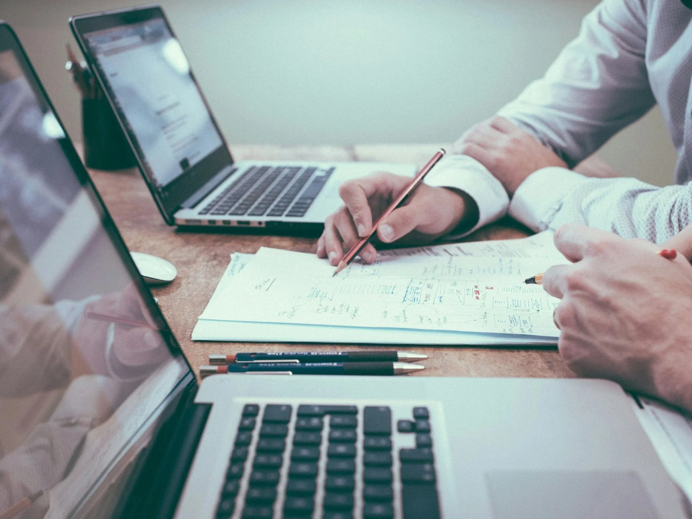 Image of two adults reviewing documents