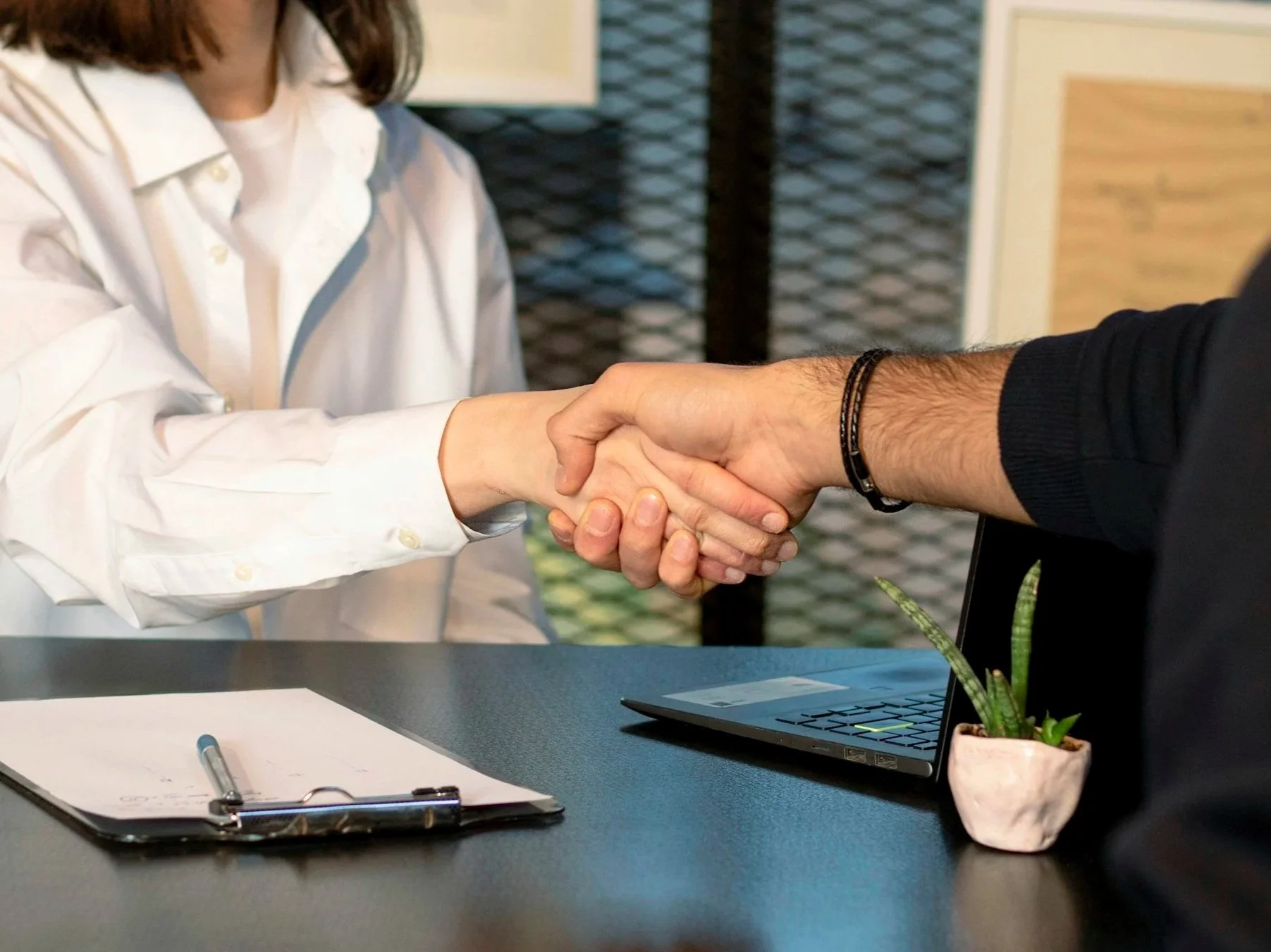 Image of two businesspeople shaking hands