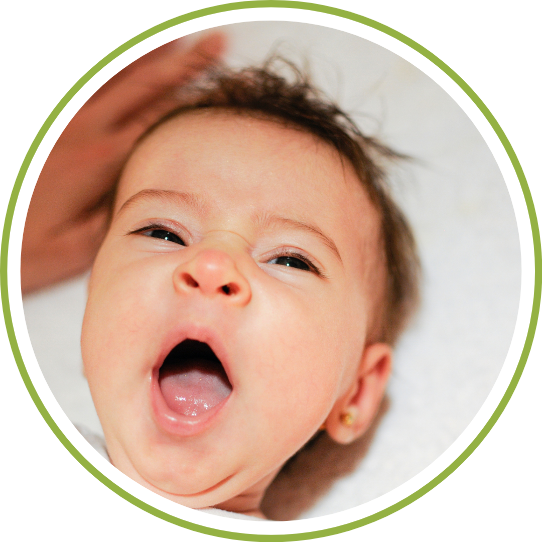 Baby yawning during gentle, no-cry sleep training with a responsive pediatric sleep consultant