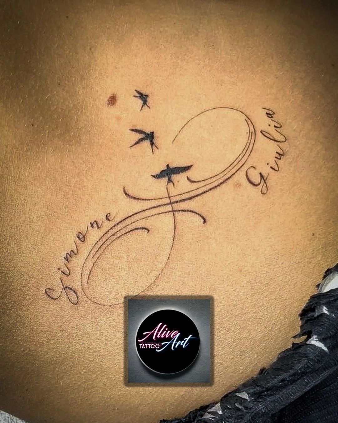 Tattoo of the words 'honey' and 'giving' written in cursive, connected by a swirling line, with three flying birds above.