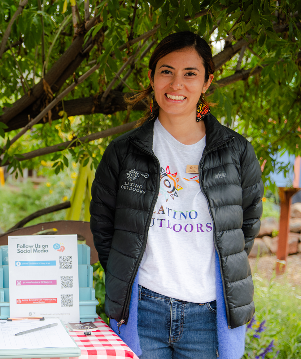 A young girl with brown hair working in the orchards
