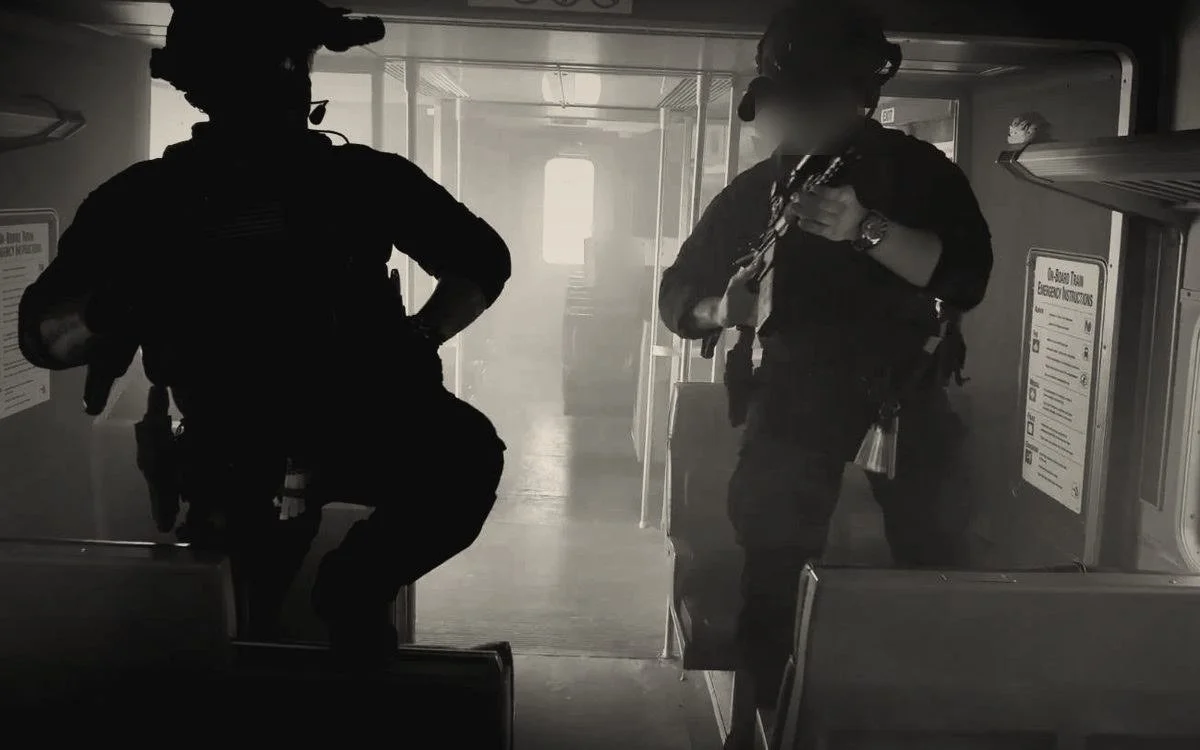 Tactical team moving through a train car