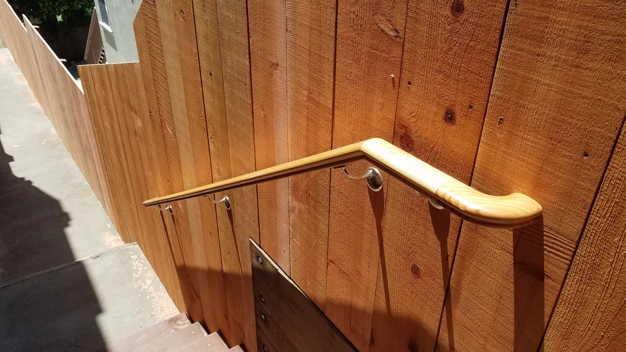 Redwood fence on top of a retaining wall in the Oakland Hills.