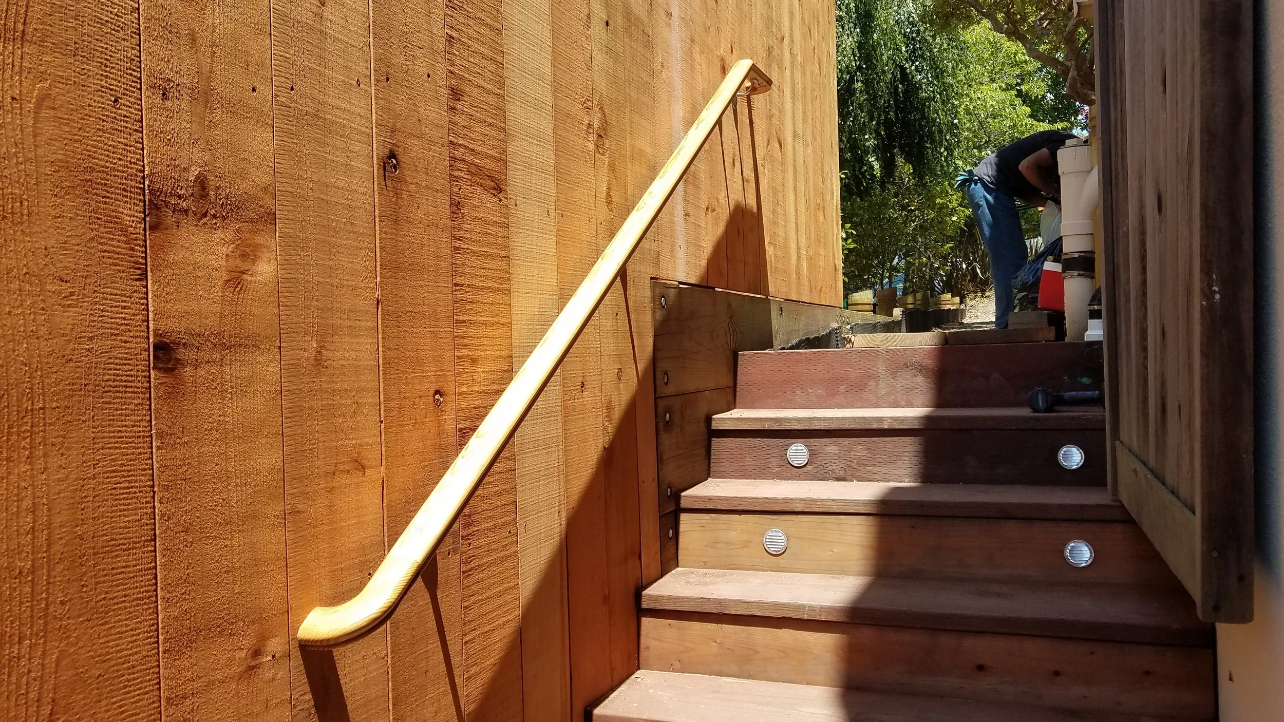 Redwood fence on top of a retaining wall in the Oakland Hills.